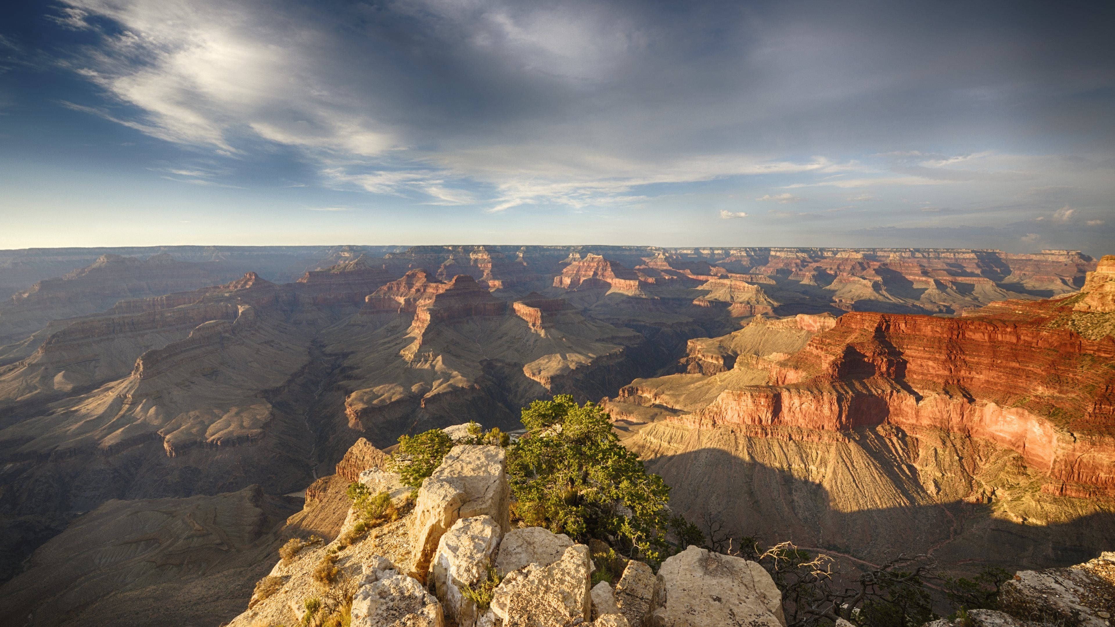 Grand Canyon, golden sunset light, layered red rock formations, 4K Desktop Wallpaper