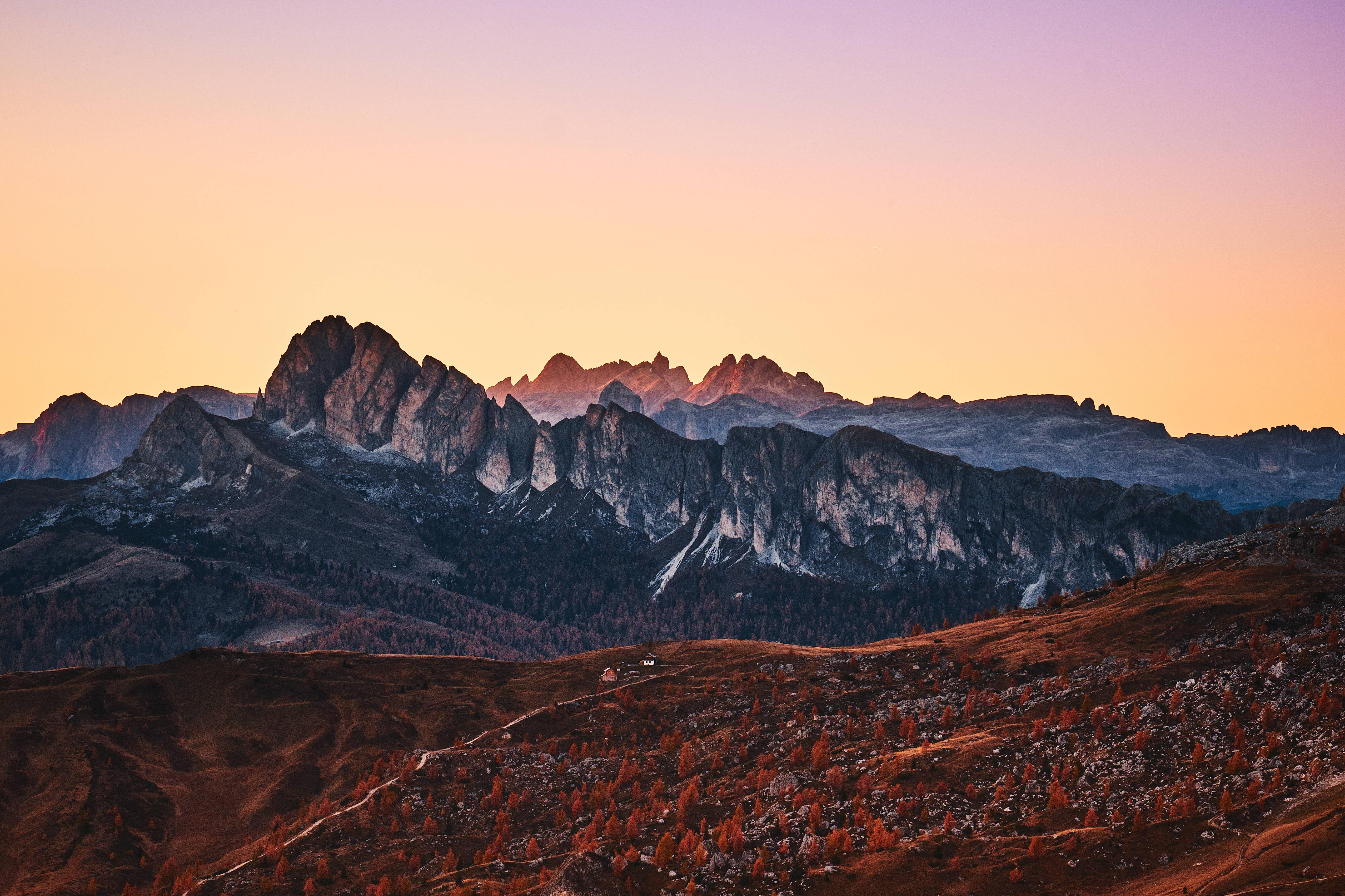 Sunset, jagged mountain peaks, warm gold, 5K Desktop Wallpaper