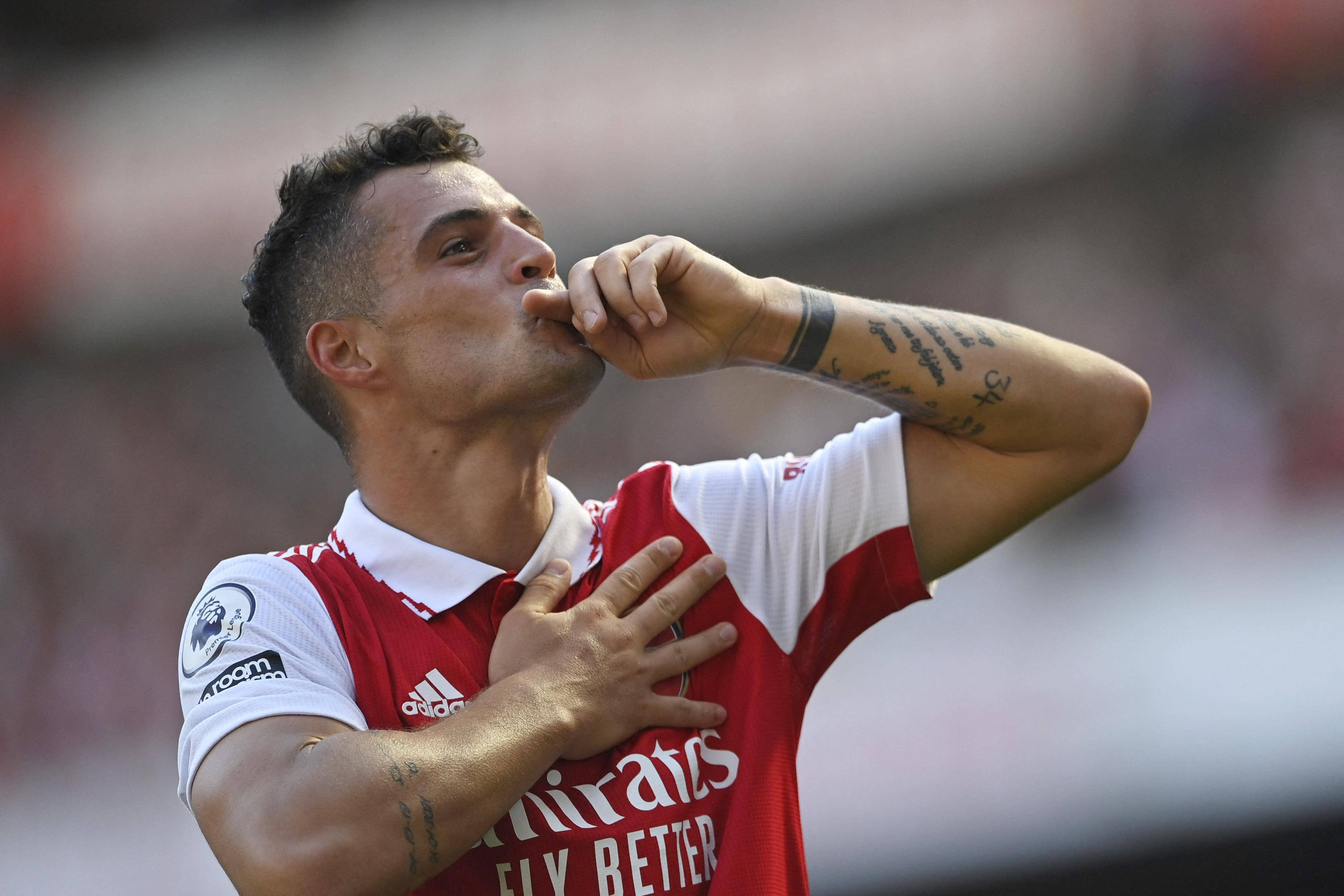 Granit Xhaka, red Arsenal jersey, hand over heart, 4K Desktop Wallpaper