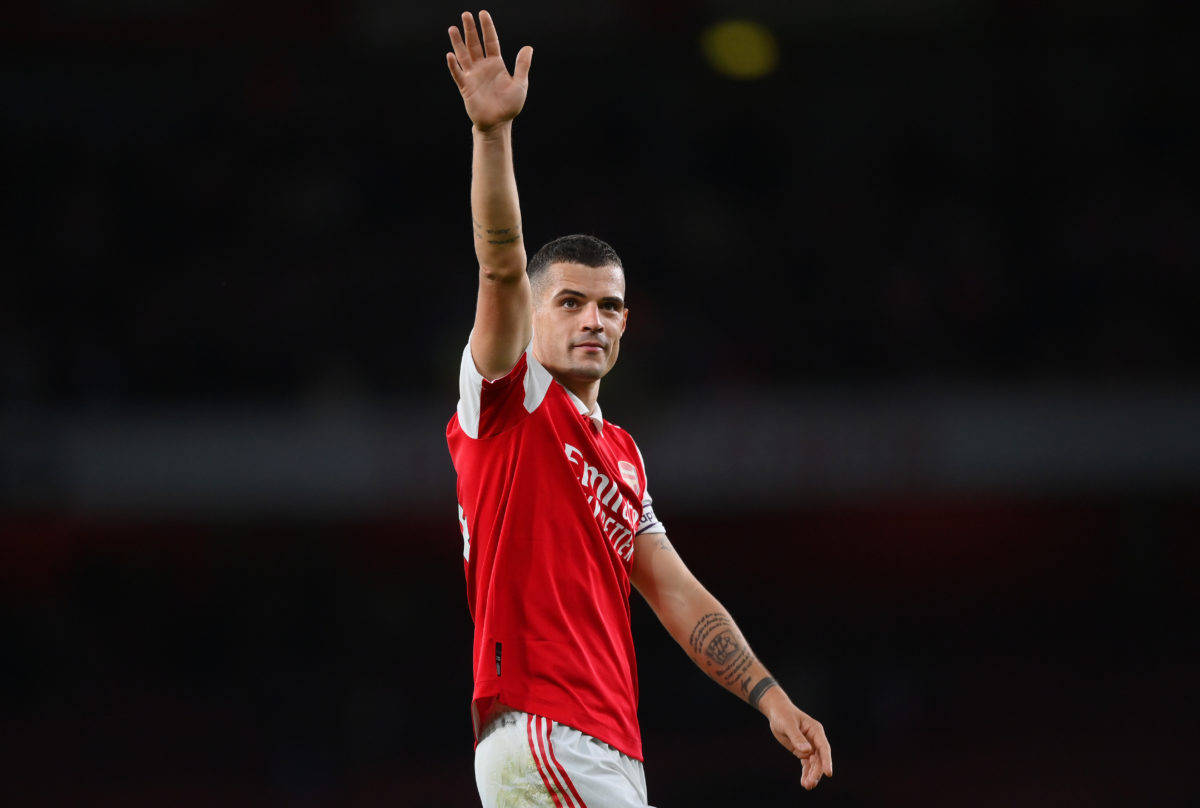 Granit Xhaka, red Arsenal jersey, stadium lights, SD Desktop Wallpaper