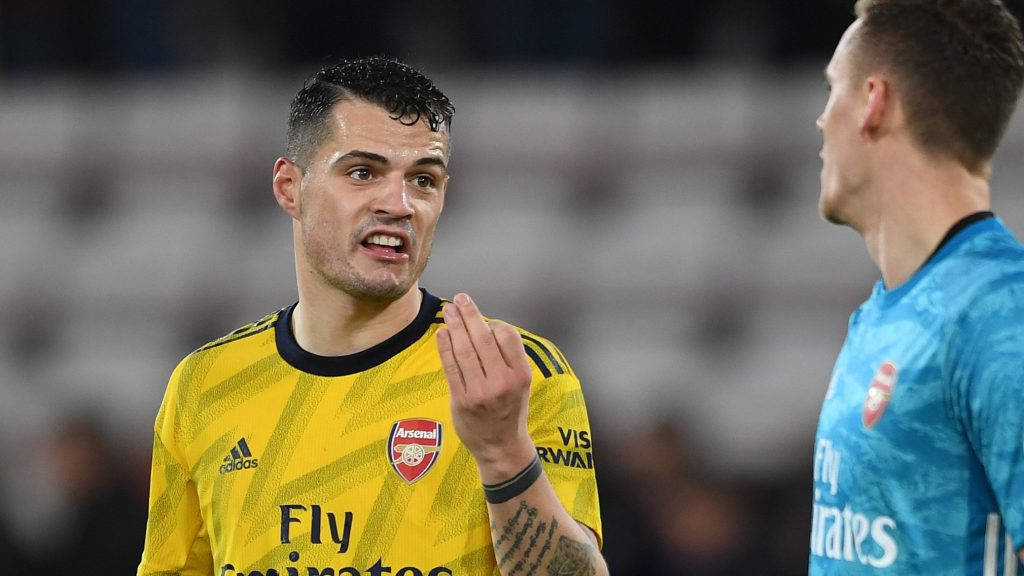 Granit Xhaka, yellow Arsenal jersey, stadium lights, SD Desktop Wallpaper