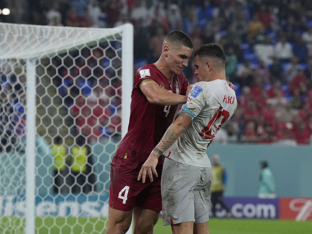 Granit Xhaka, maroon and gray jerseys, white goal net, SD Desktop Wallpaper