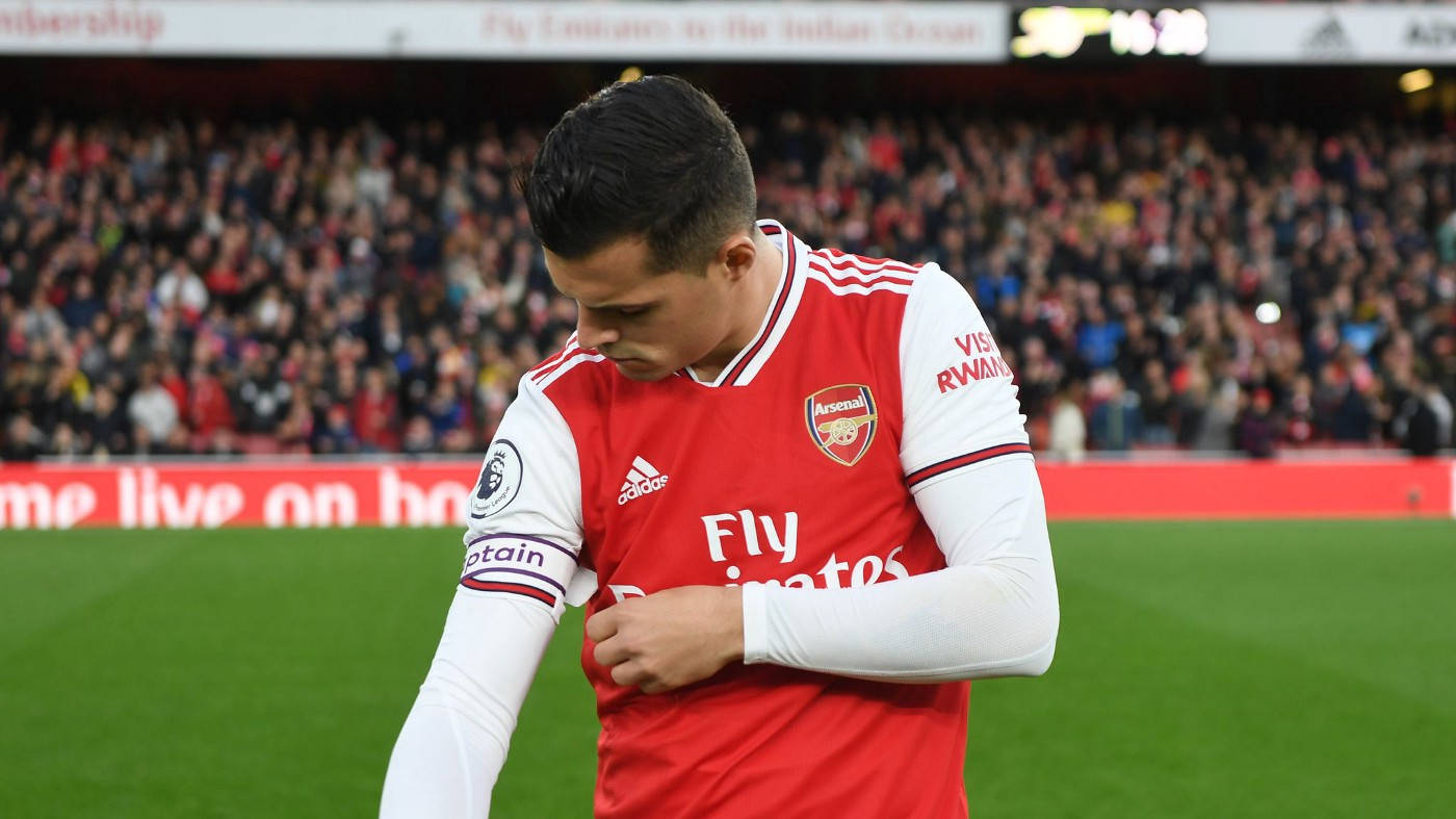 Granit Xhaka, red Arsenal jersey, green pitch, HD Desktop Wallpaper