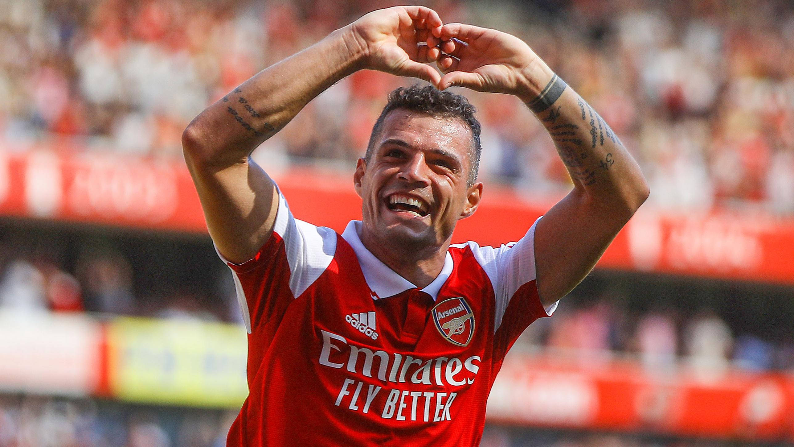 Granit Xhaka, red Arsenal jersey, heart with his hands, 2K Desktop Wallpaper
