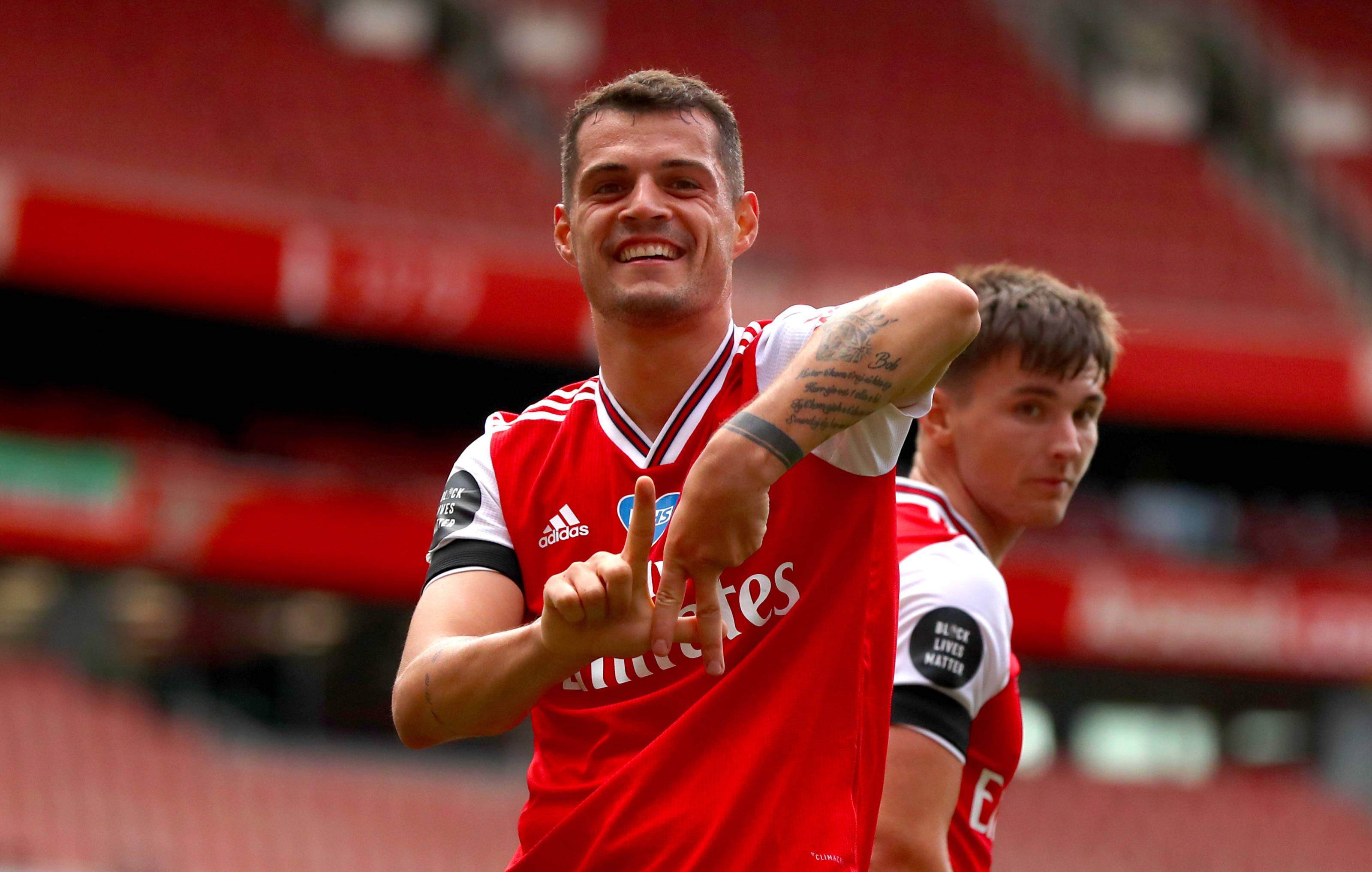Granit Xhaka, red jersey, finger gesture, 2K Desktop Wallpaper
