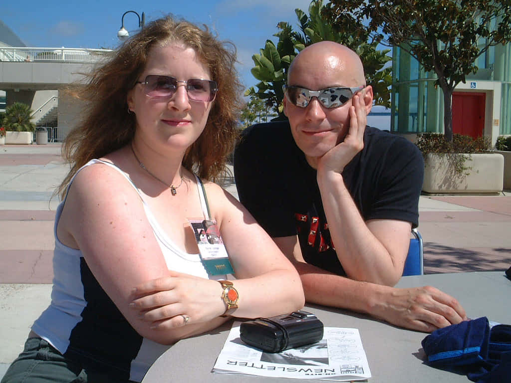 Grant Morrison, sunglasses, outdoor table, SD Desktop Wallpaper