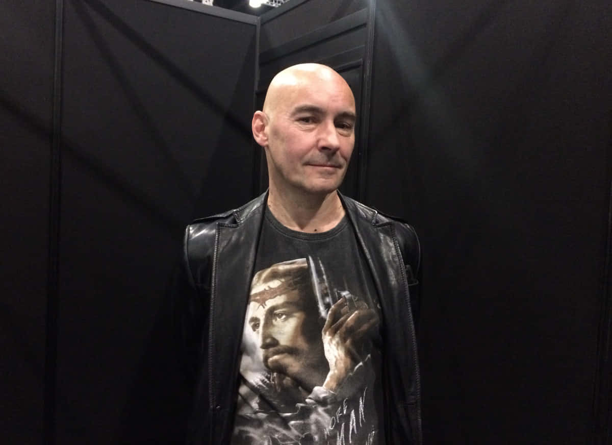 Grant Morrison, black leather jacket, graphic t-shirt, SD Desktop Wallpaper