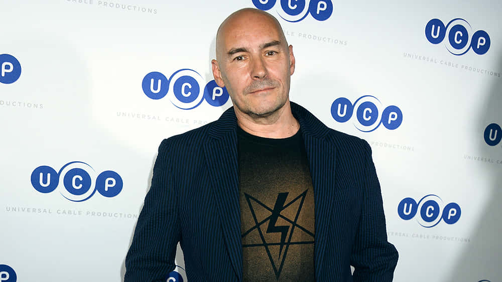 Grant Morrison, dark pinstripe blazer, graphic tee, SD Desktop Wallpaper