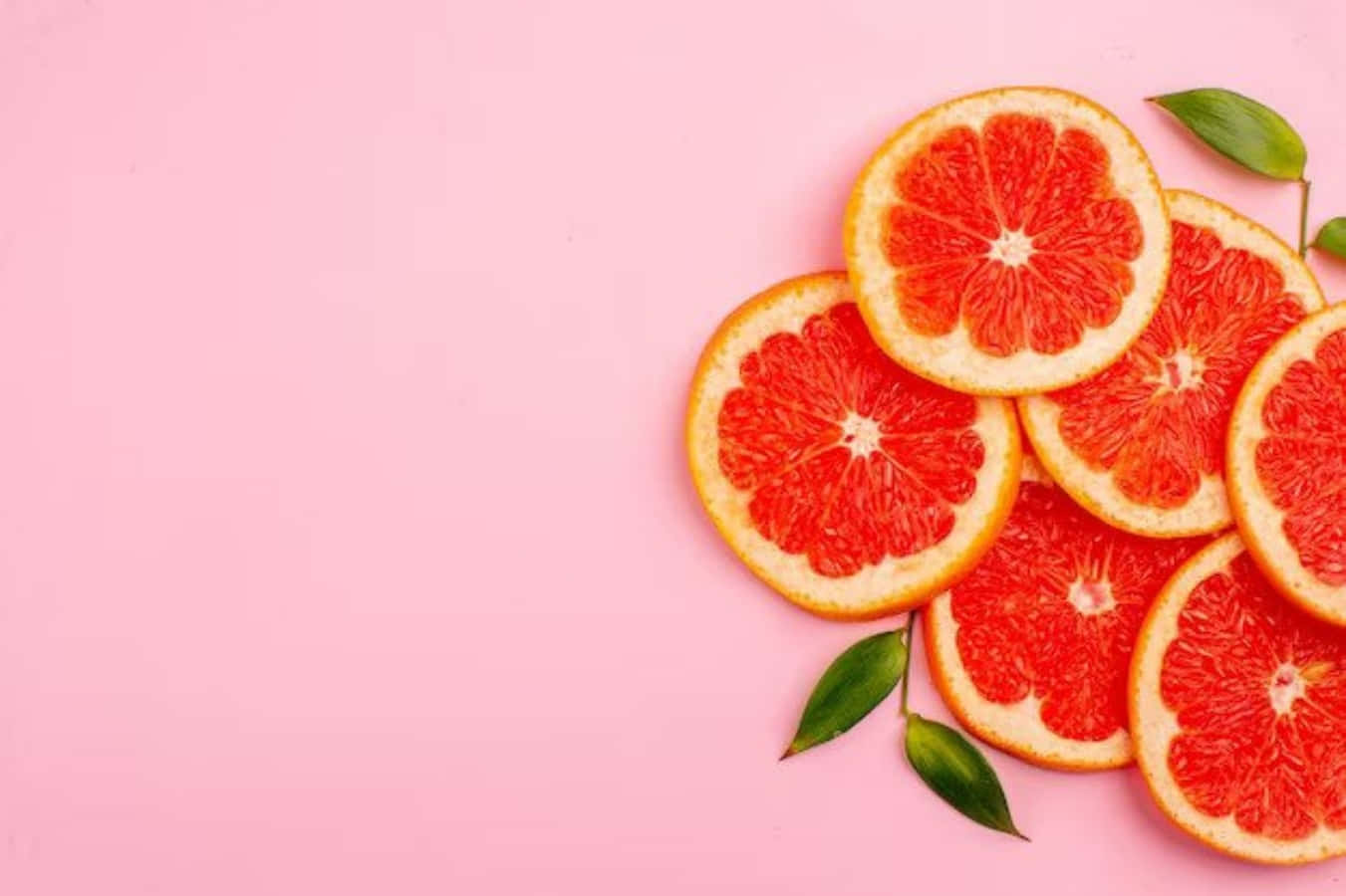 Pink Grapefruit, red grapefruit slices, green leaves, HD Desktop Wallpaper
