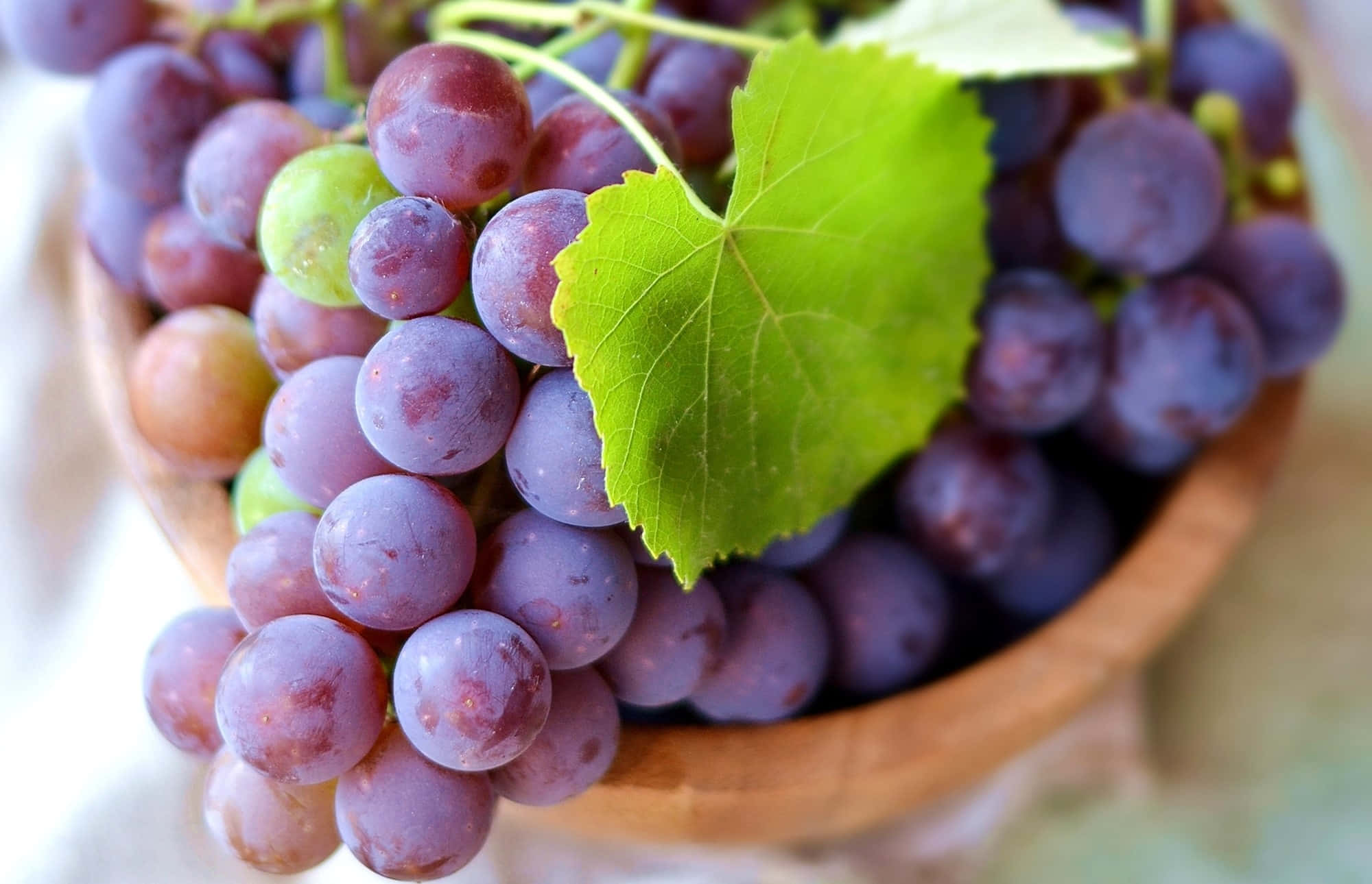 purple grapes, vibrant green leaf, wooden bowl, Full HD Desktop Wallpaper