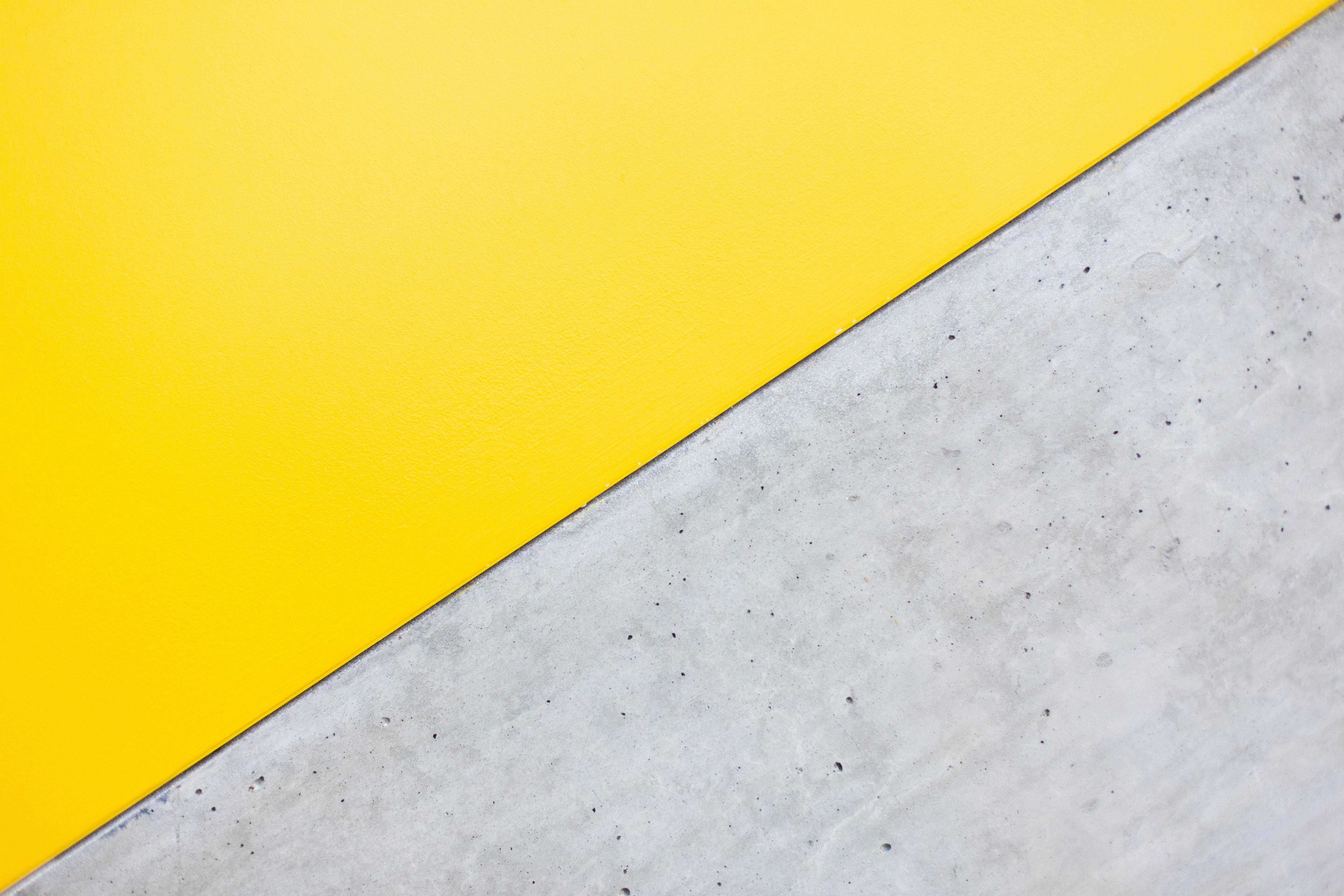 yellow panel, textured gray concrete, diagonal split composition, 5K Desktop Wallpaper