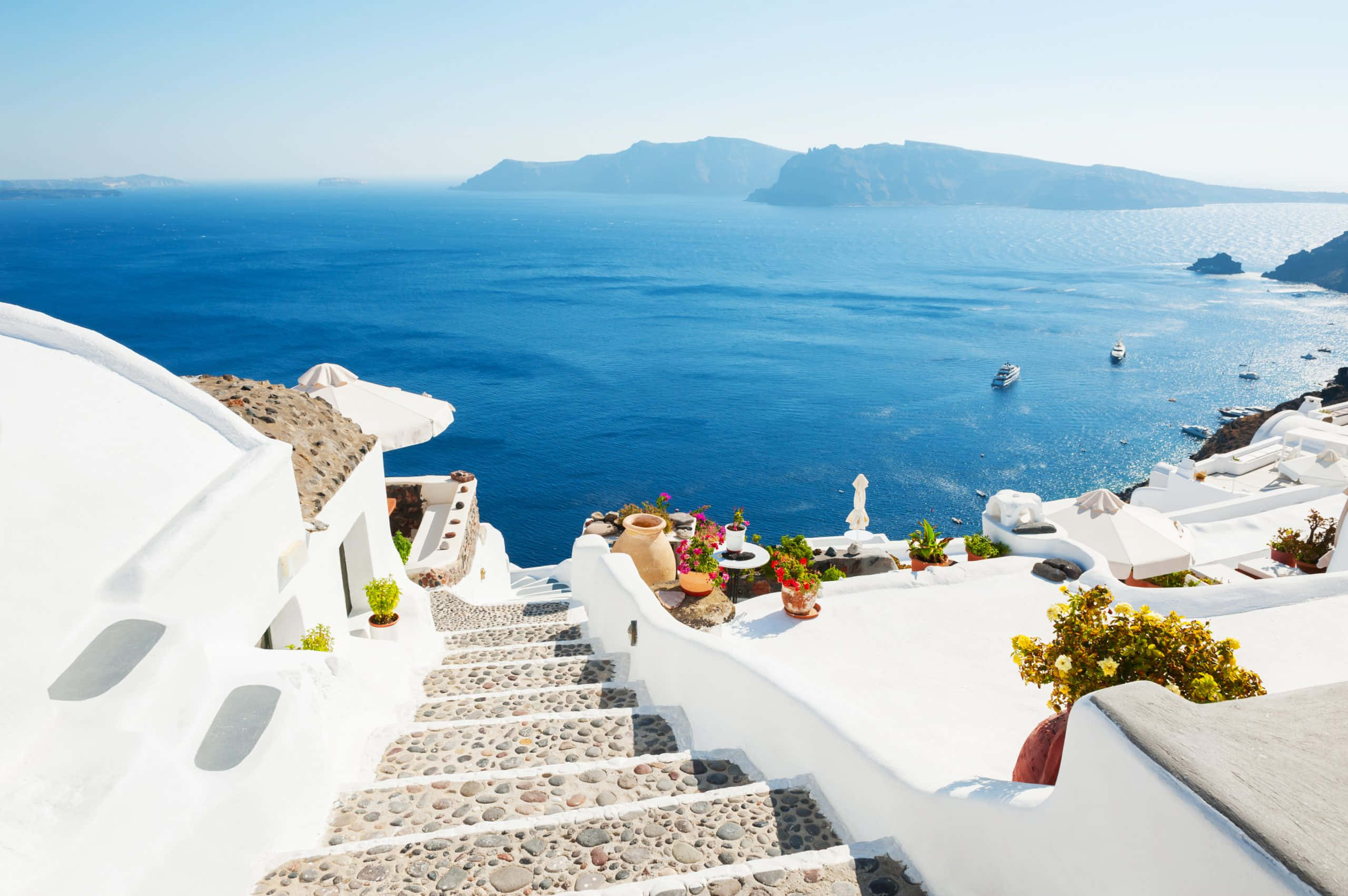 Greek Beach, white-washed stairs, vibrant blue Aegean Sea, 2K Desktop Wallpaper
