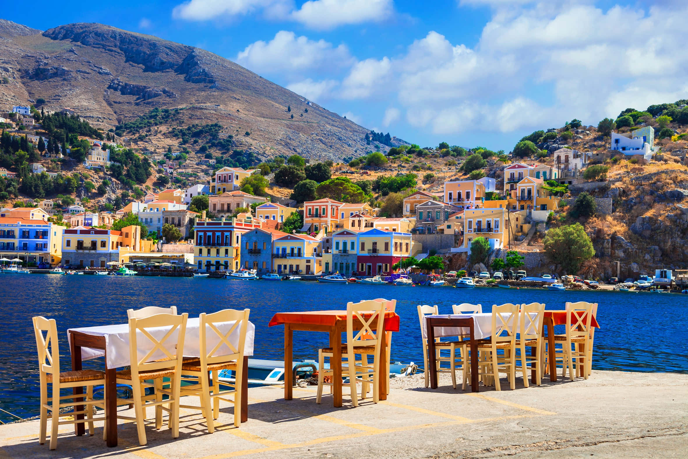Greek Beach, cliffside village houses, calm blue sea, Full HD Desktop Wallpaper