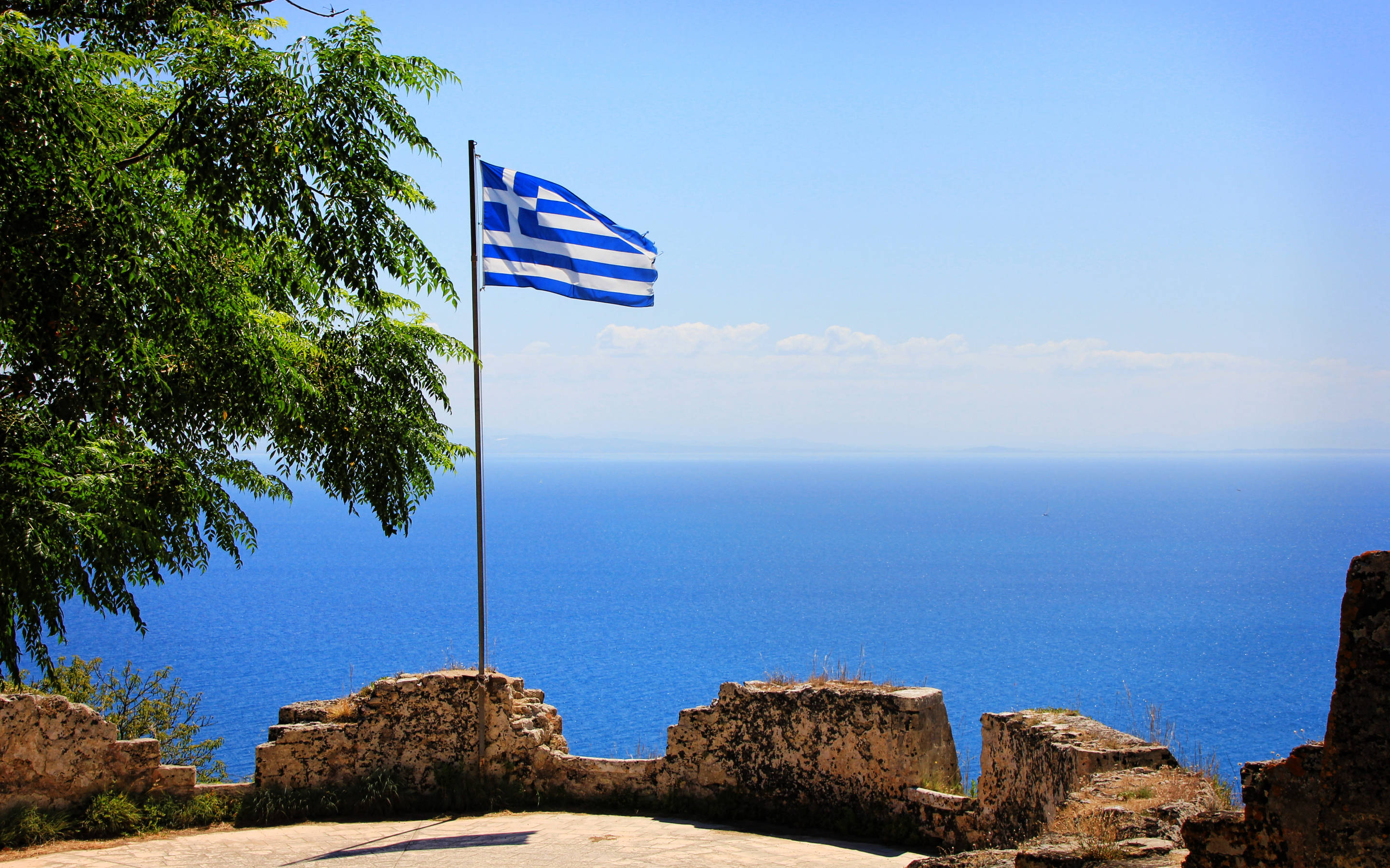 Greek flag, ancient stone ruins, deep blue sea, 2K Desktop Wallpaper