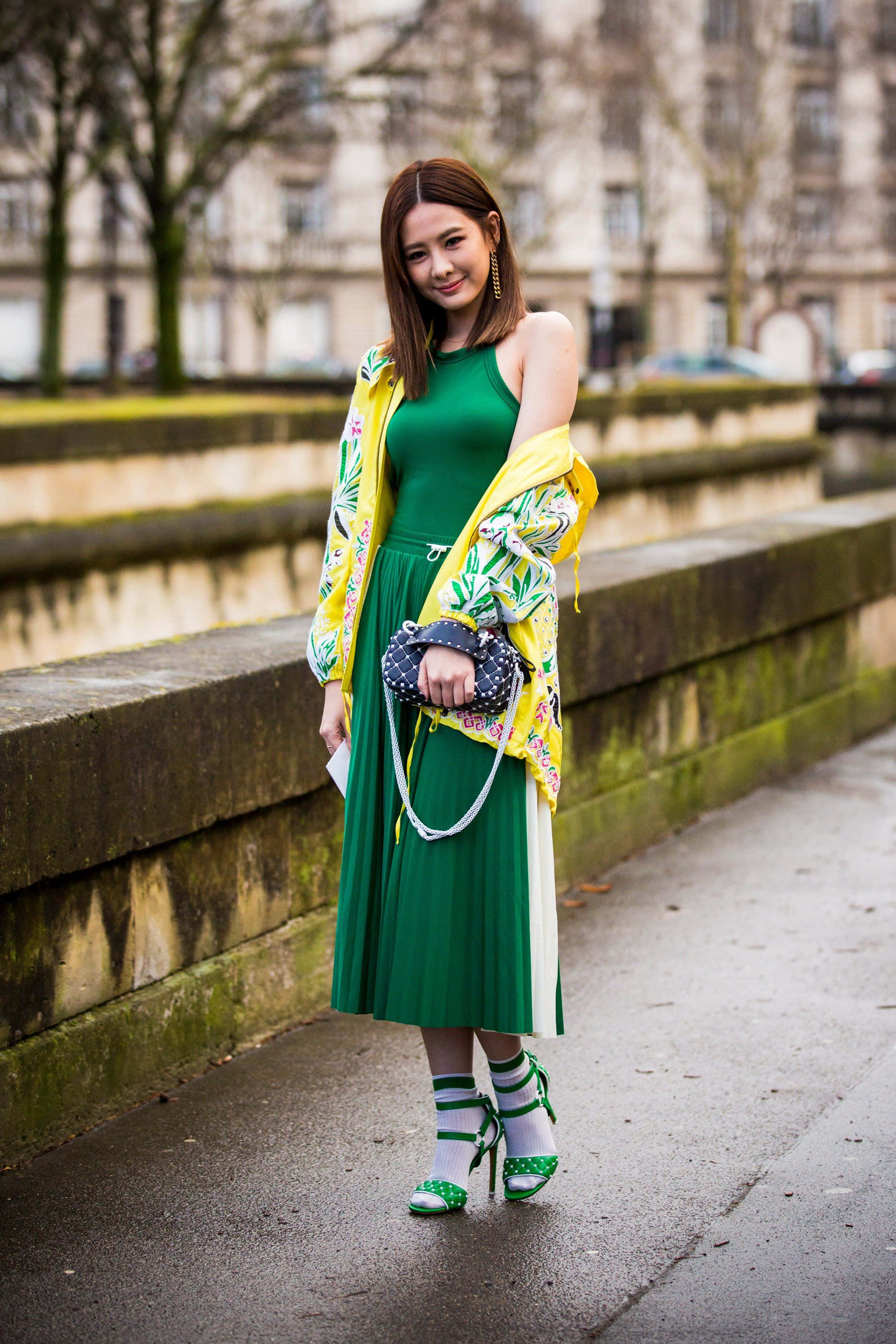 vibrant green dress, floral yellow jacket, wet urban sidewalk, 2K Phone Wallpaper