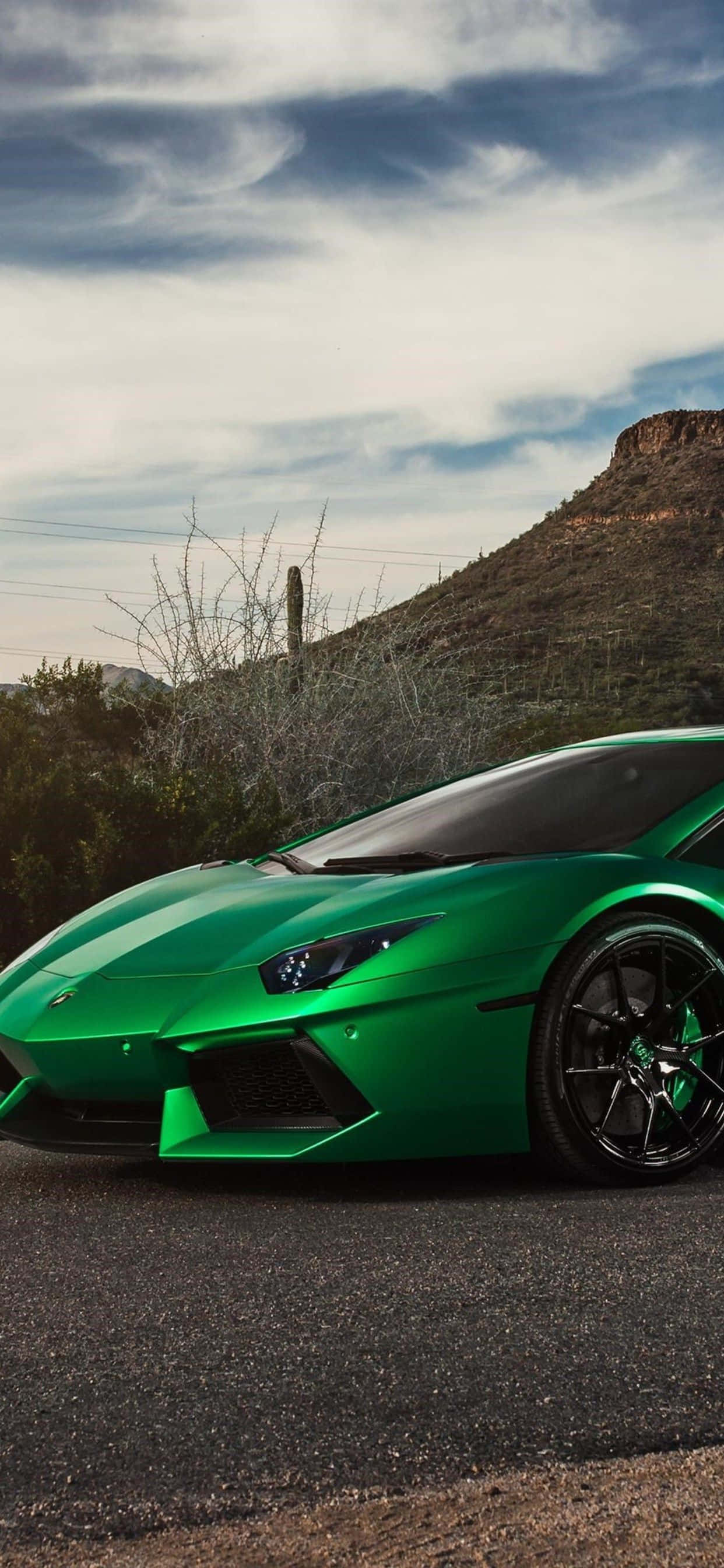green Lamborghini, desert road, rocky hills, 2K Phone Wallpaper