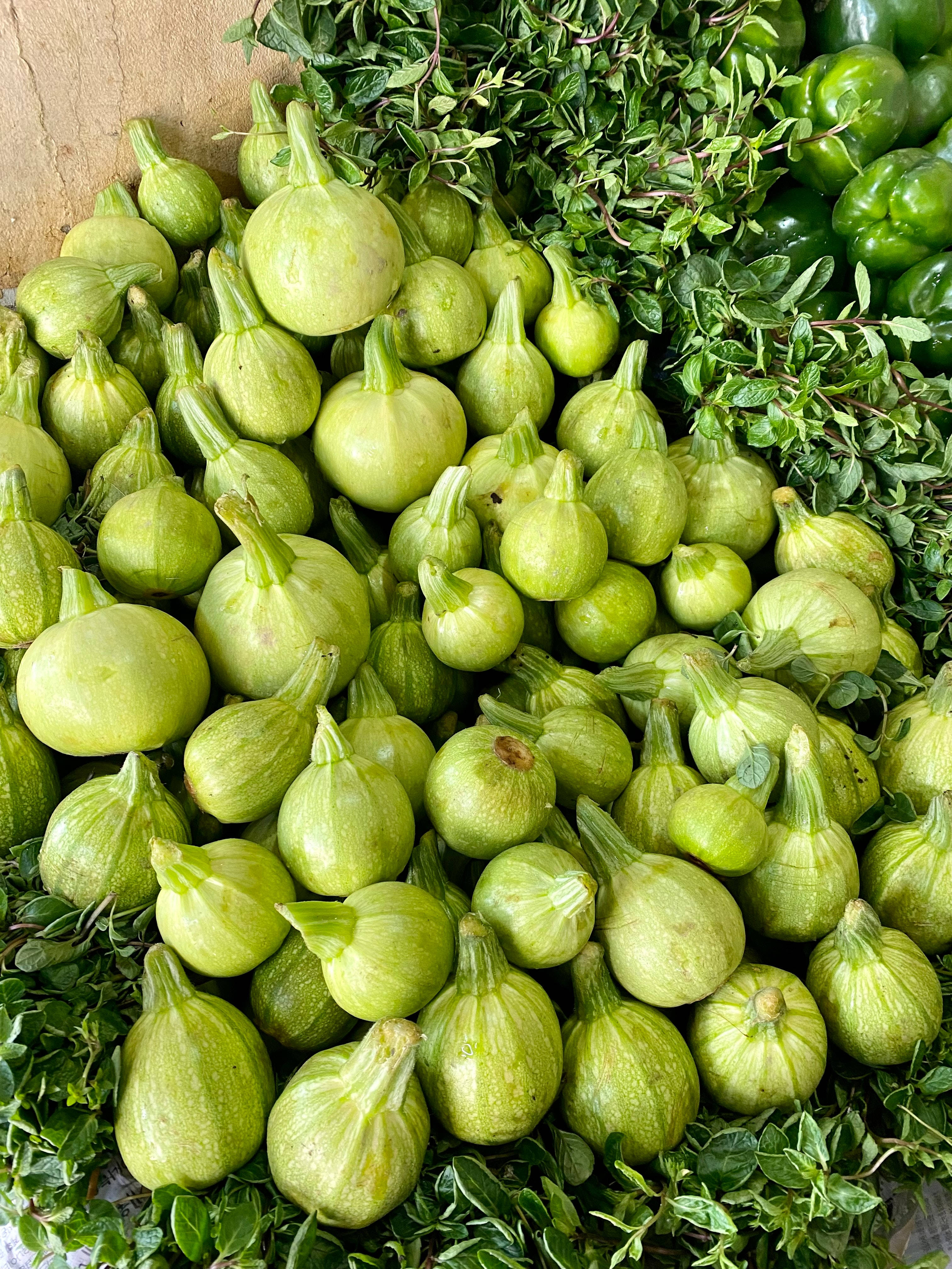 fresh green figs, lush green leaves, market stall, 4K Phone Wallpaper