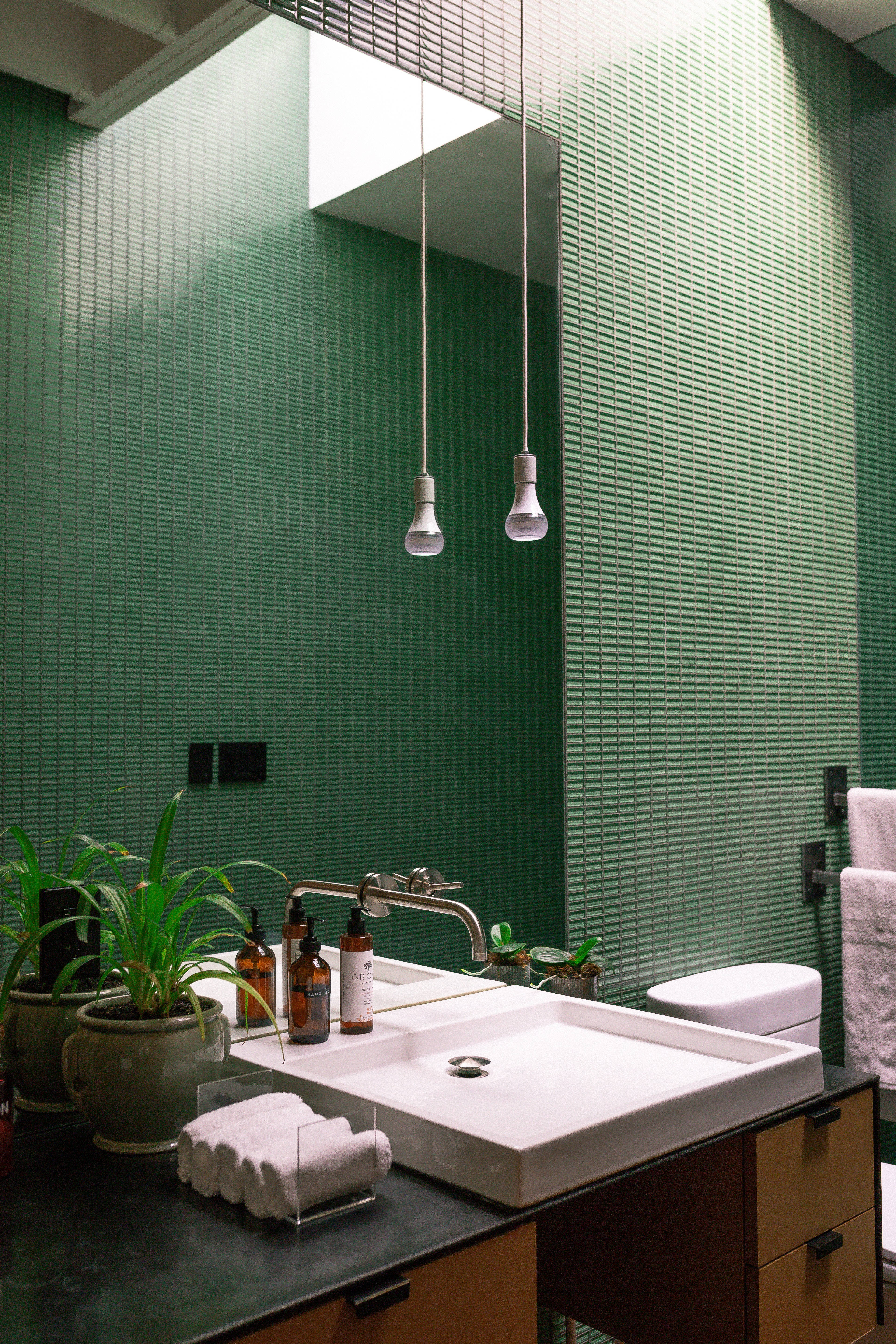 emerald green textured tiles, white sink, hanging bulbs, 5K Phone Wallpaper