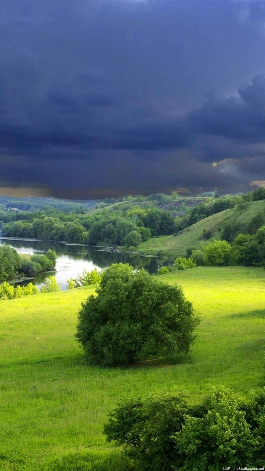 Green Nature iPhone, sunlit green field, dark storm clouds, Full HD Phone Wallpaper