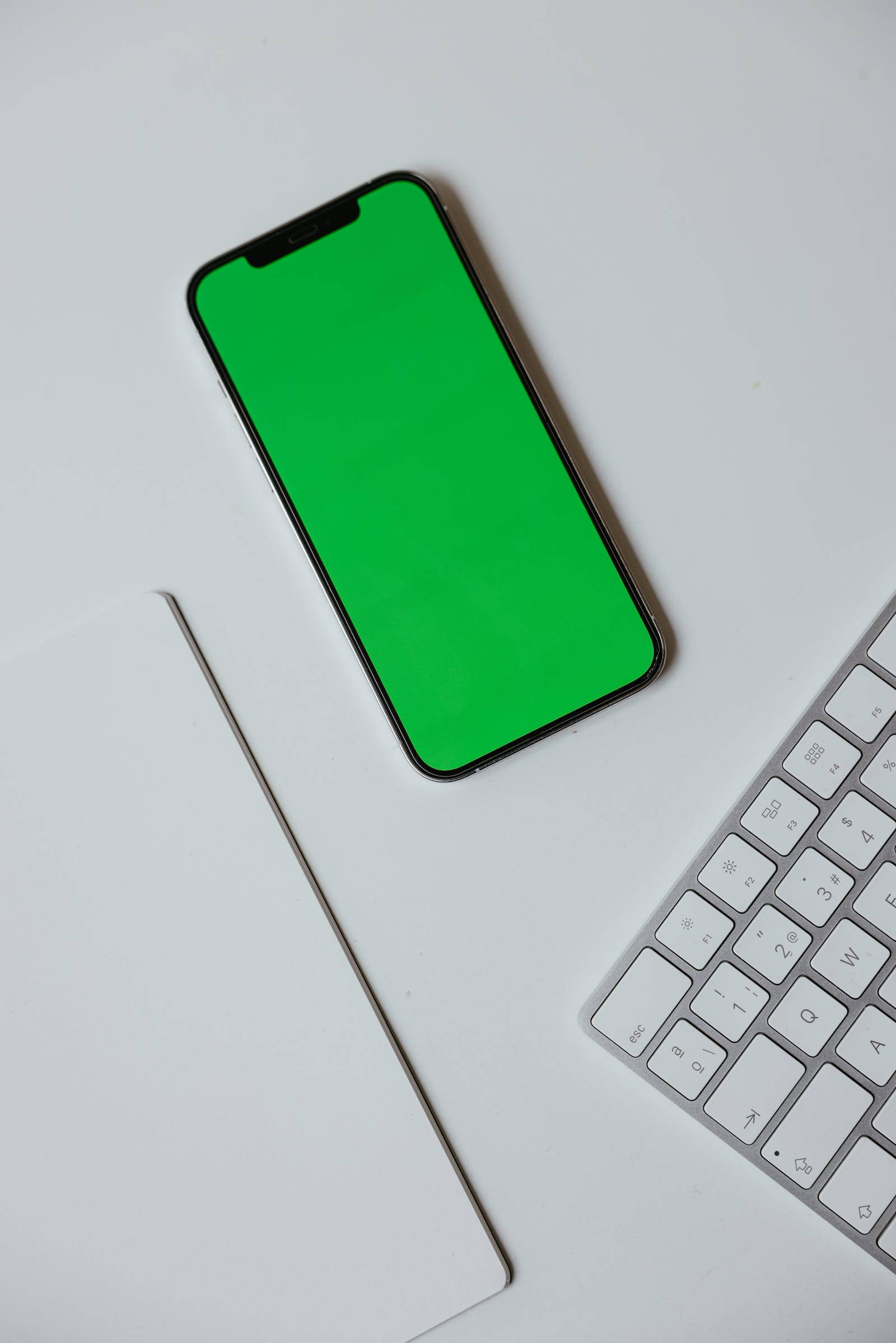 iPhone X, green screen, silver keyboard, Full HD Phone Wallpaper