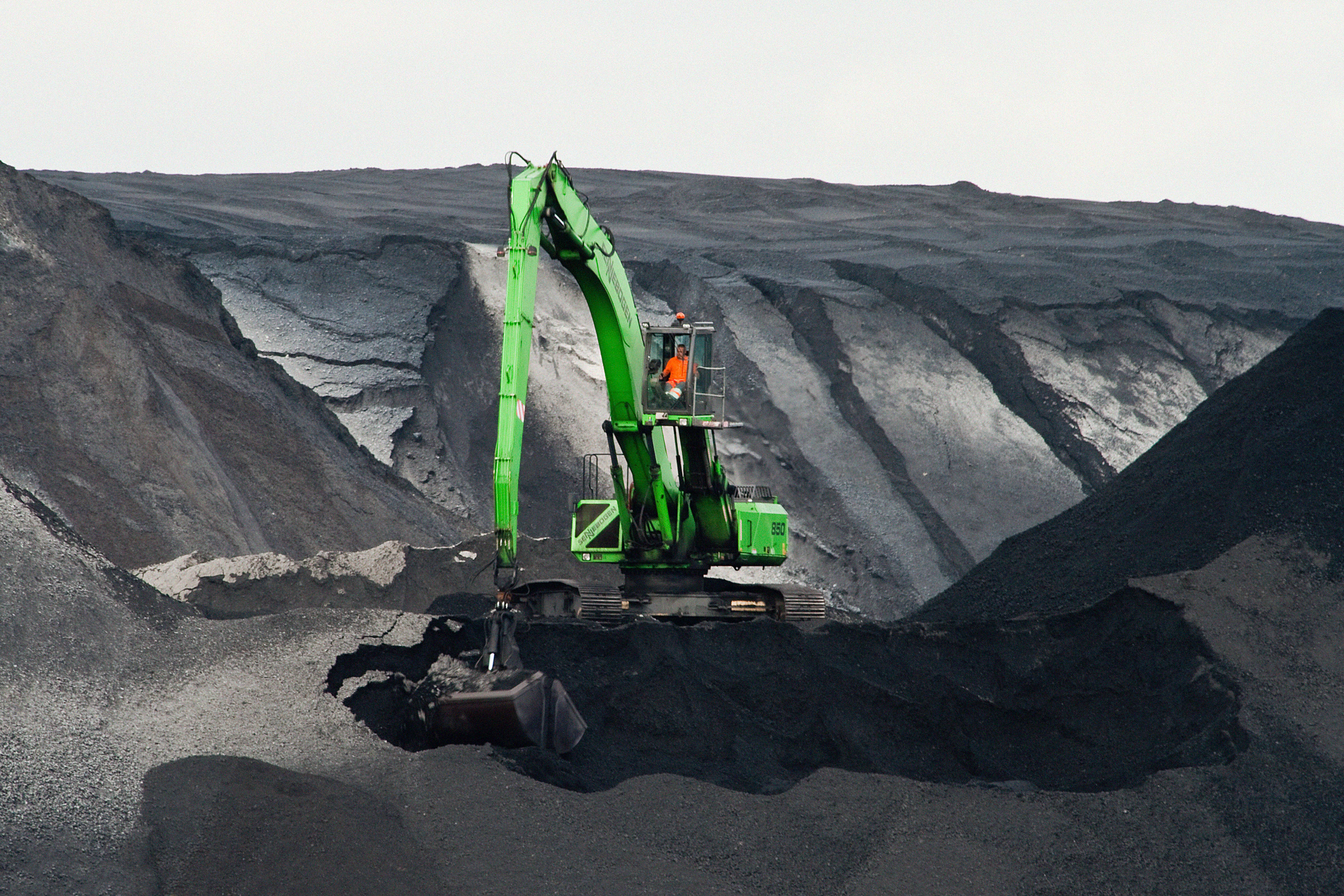 green mining machine, bright green excavator, vast gray coal mine, 2K Desktop Wallpaper
