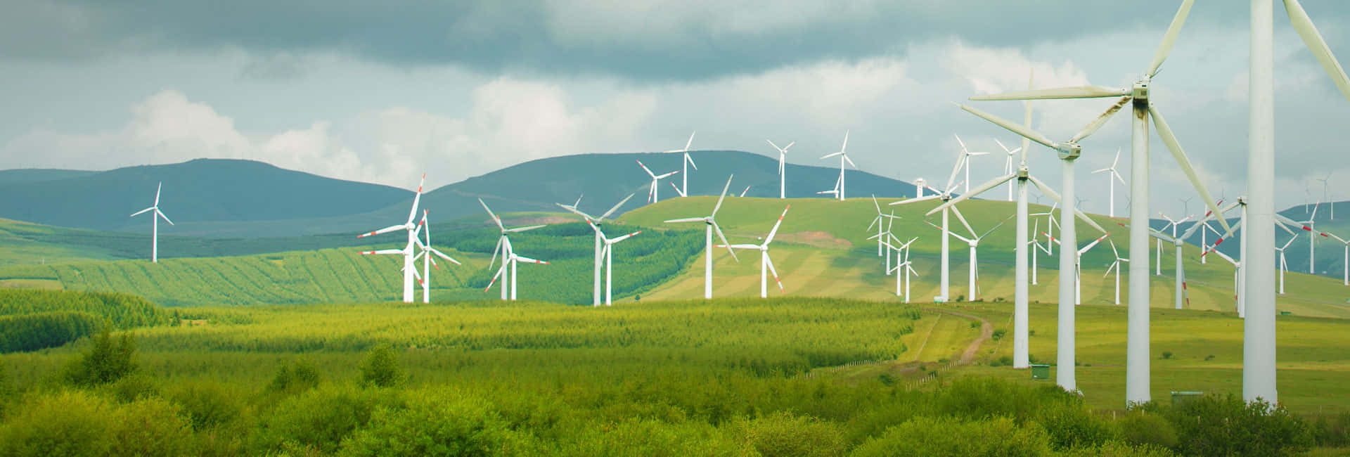 green field, white wind turbines, cloudy sky, Full HD Desktop Wallpaper