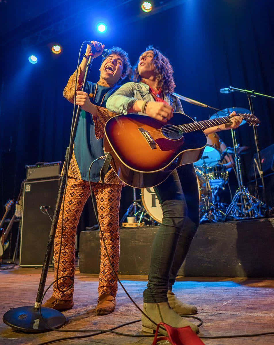 Greta Van Fleet, acoustic guitar, blue stage lights, SD Phone Wallpaper