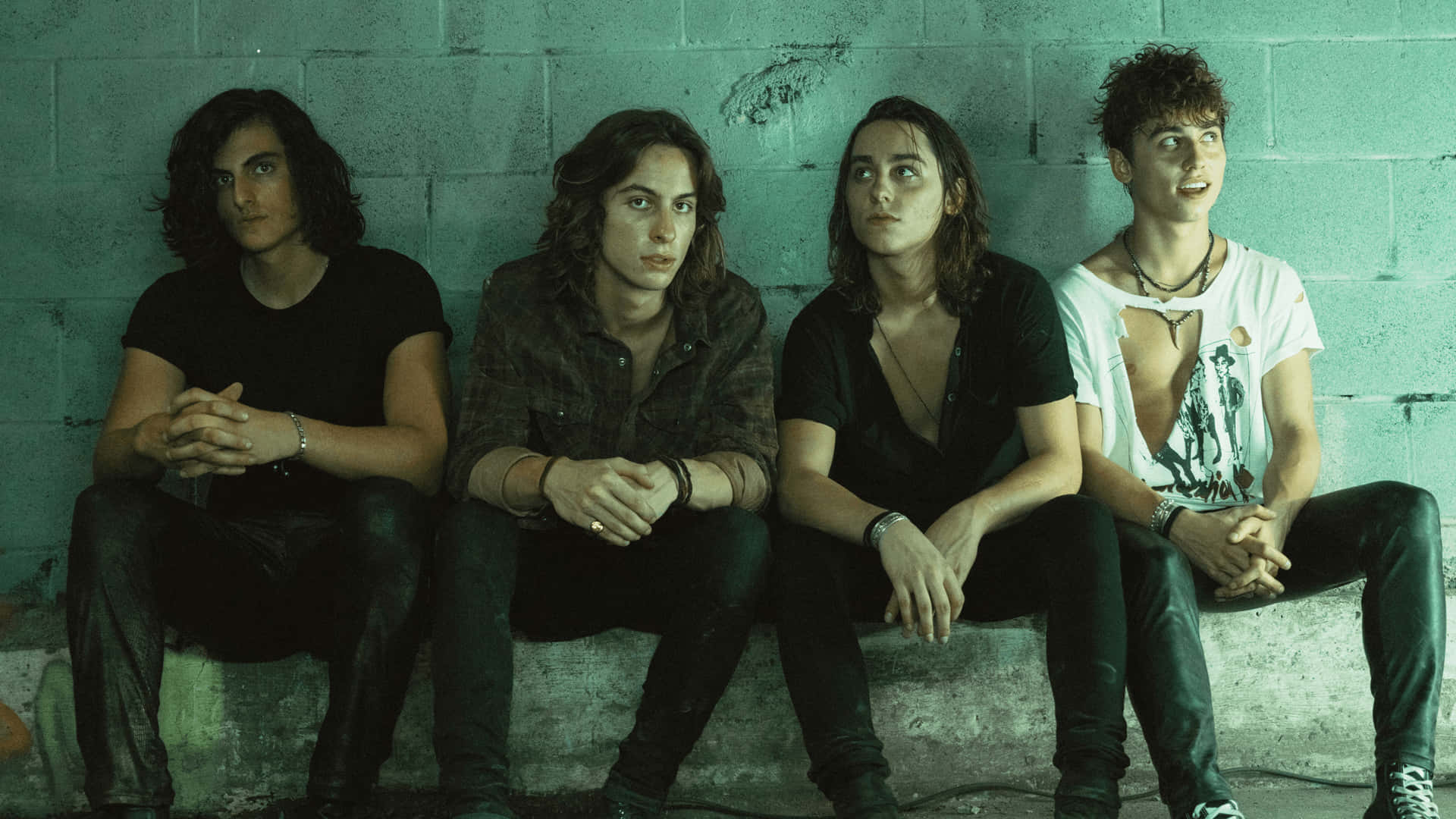 Greta Van Fleet, teal-painted concrete wall, gritty urban setting, Full HD Desktop Wallpaper