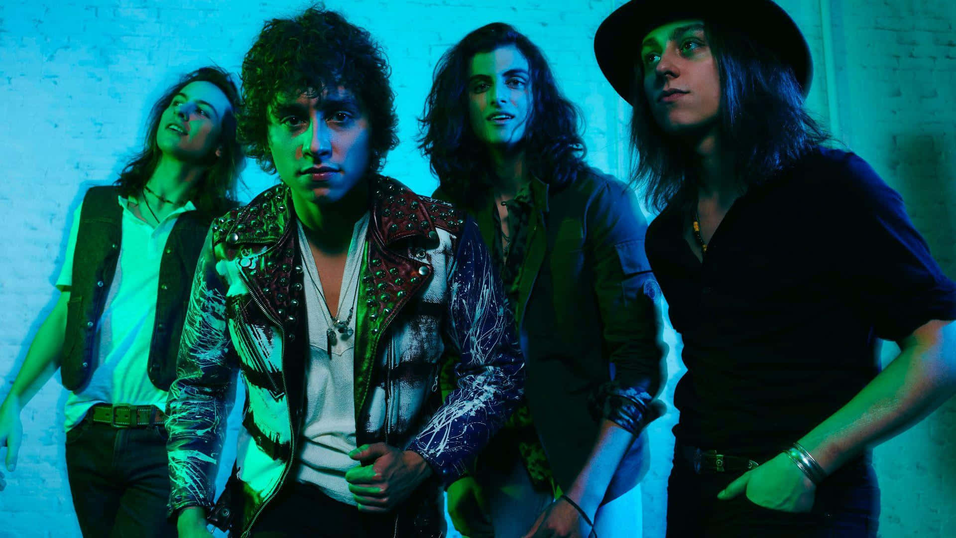 Greta Van Fleet, neon-lit brick wall, vibrant blue lighting, Full HD Desktop Wallpaper