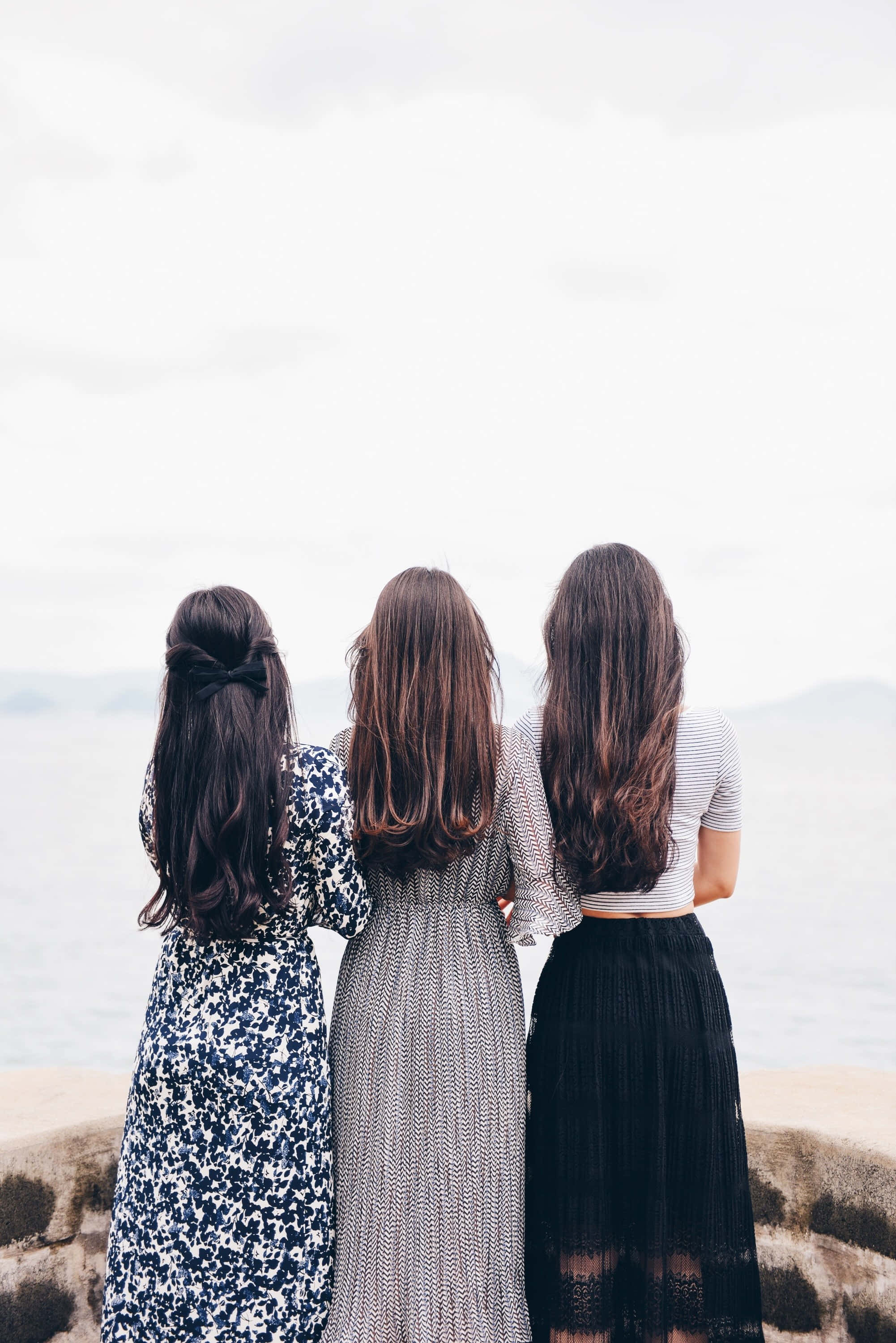 three women, long hair, rocky cliff, 2K Phone Wallpaper