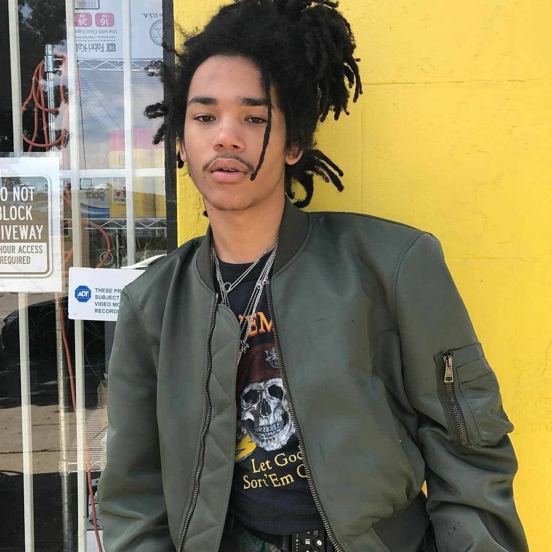 green bomber jacket, dreadlocks, bright yellow wall, SD Desktop Wallpaper