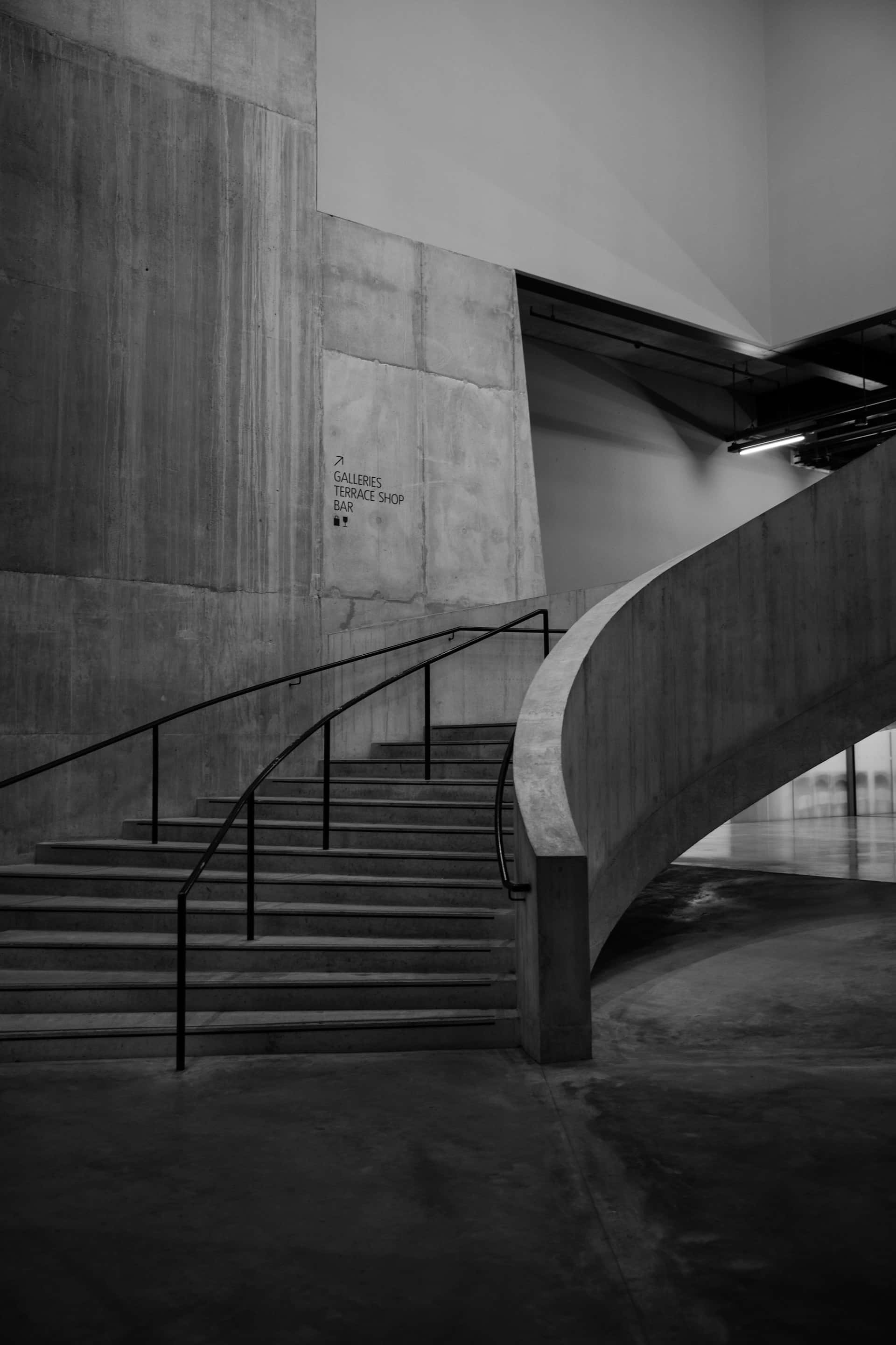 concrete staircase, curved railing, minimalist interior space, 2K Phone Wallpaper