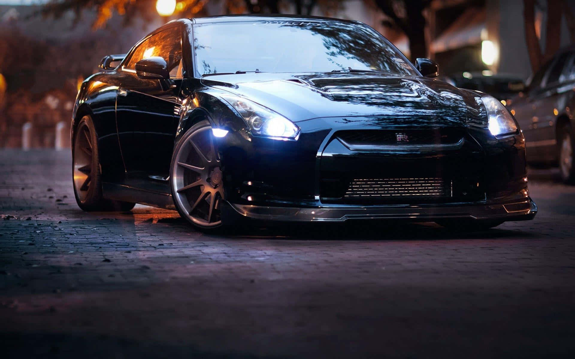 GTR Desktop, sleek black sports car, glowing headlights, Full HD Desktop Wallpaper