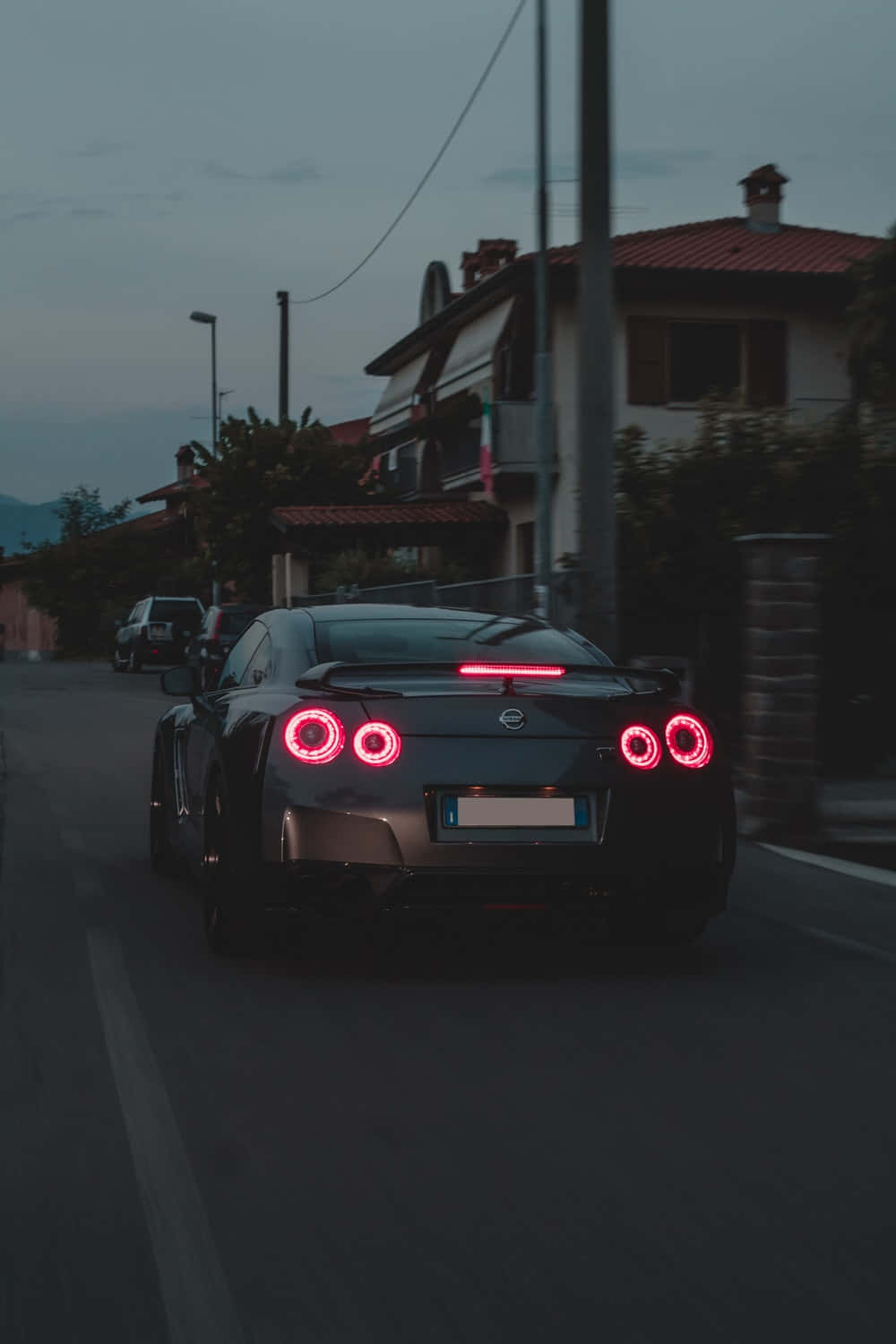 Gtr iPhone, black sports car, glowing red circular taillights, HD Phone Wallpaper