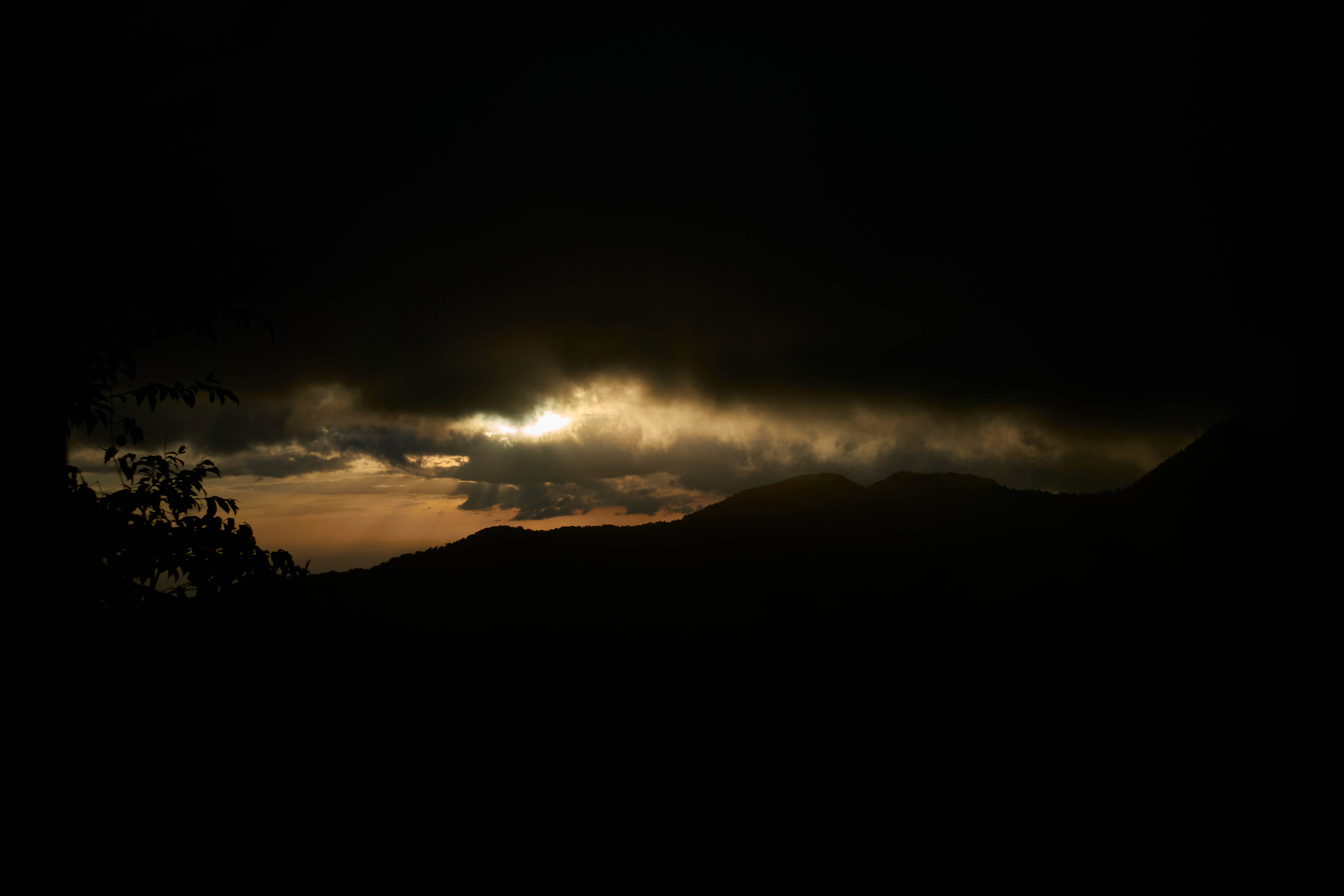 Guadeloupe, dark storm clouds, golden sunlight, 5K Desktop Wallpaper