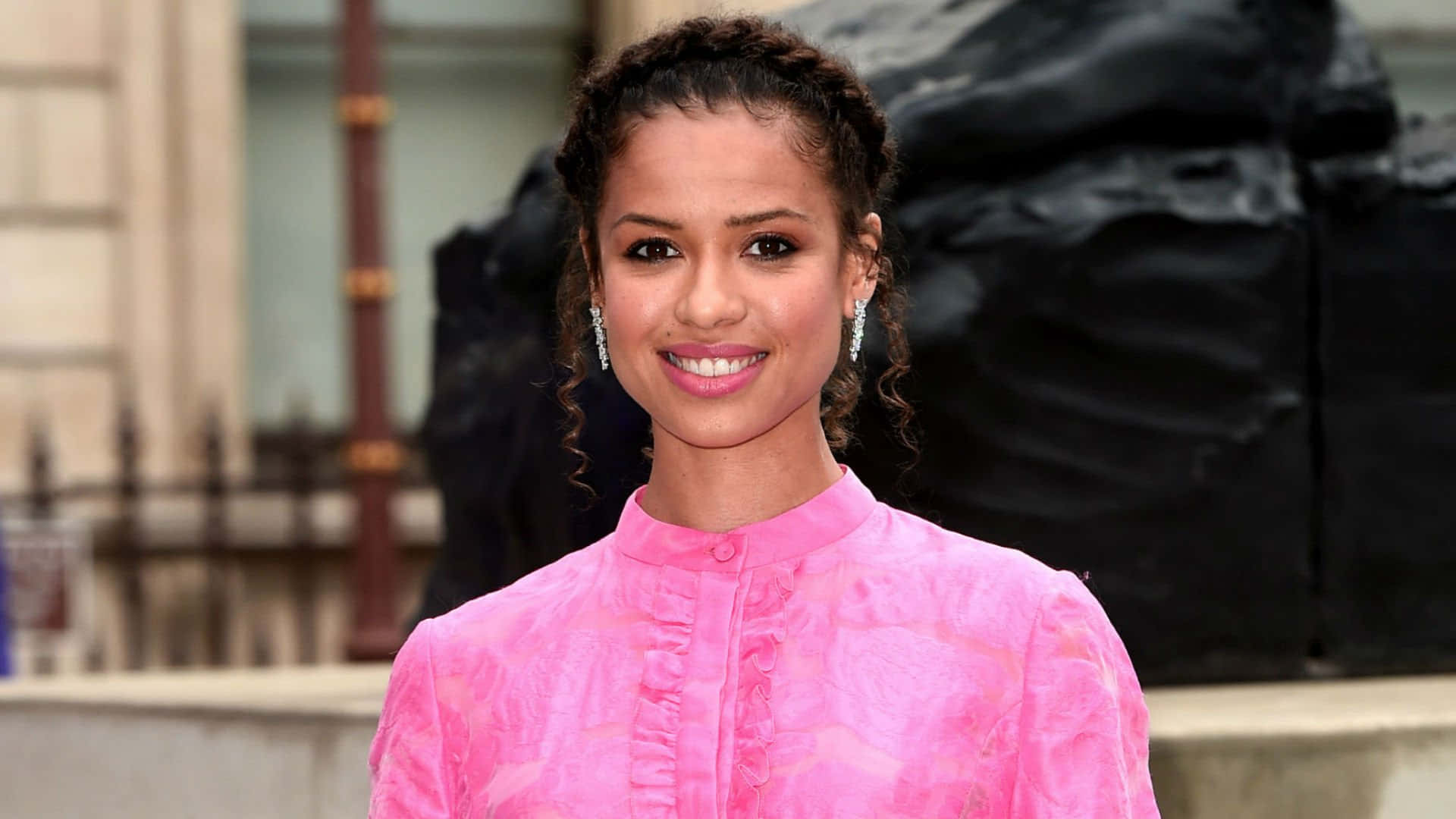 Gugu Mbatha-Raw, vibrant pink textured blouse, dark sculpture, Full HD Desktop Wallpaper