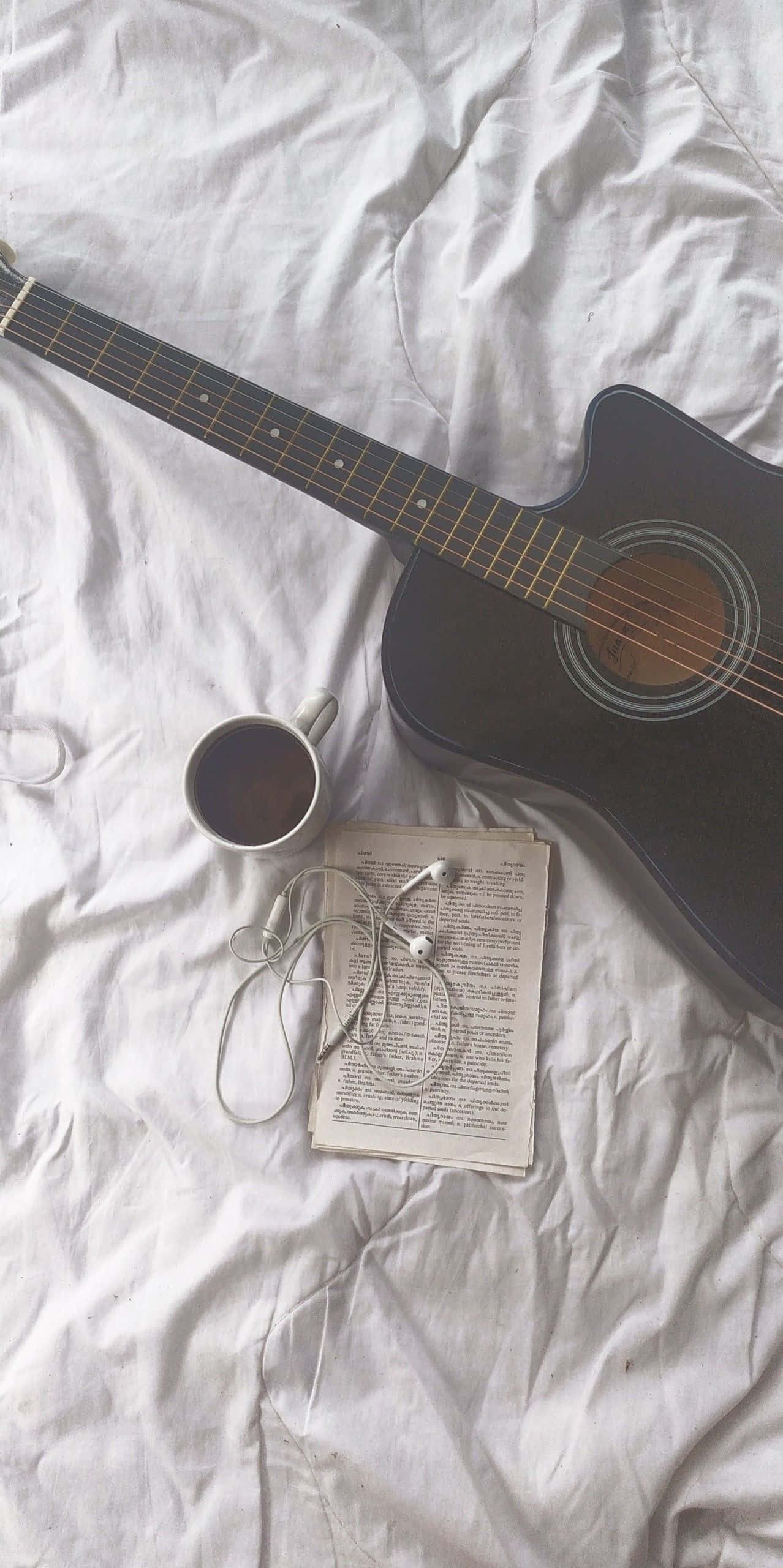 black acoustic guitar, wooden board, rumpled white bedsheet, 2K Phone Wallpaper