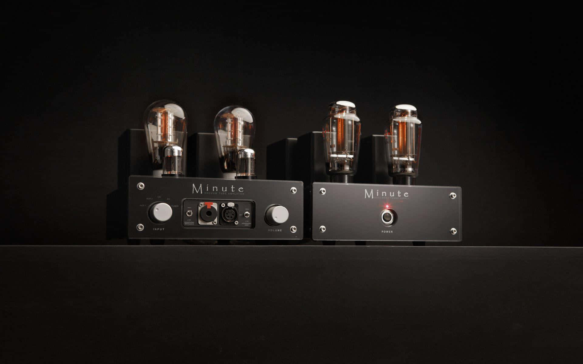 Minute audio amplifiers, glowing vacuum tubes, sleek black, Full HD Desktop Wallpaper