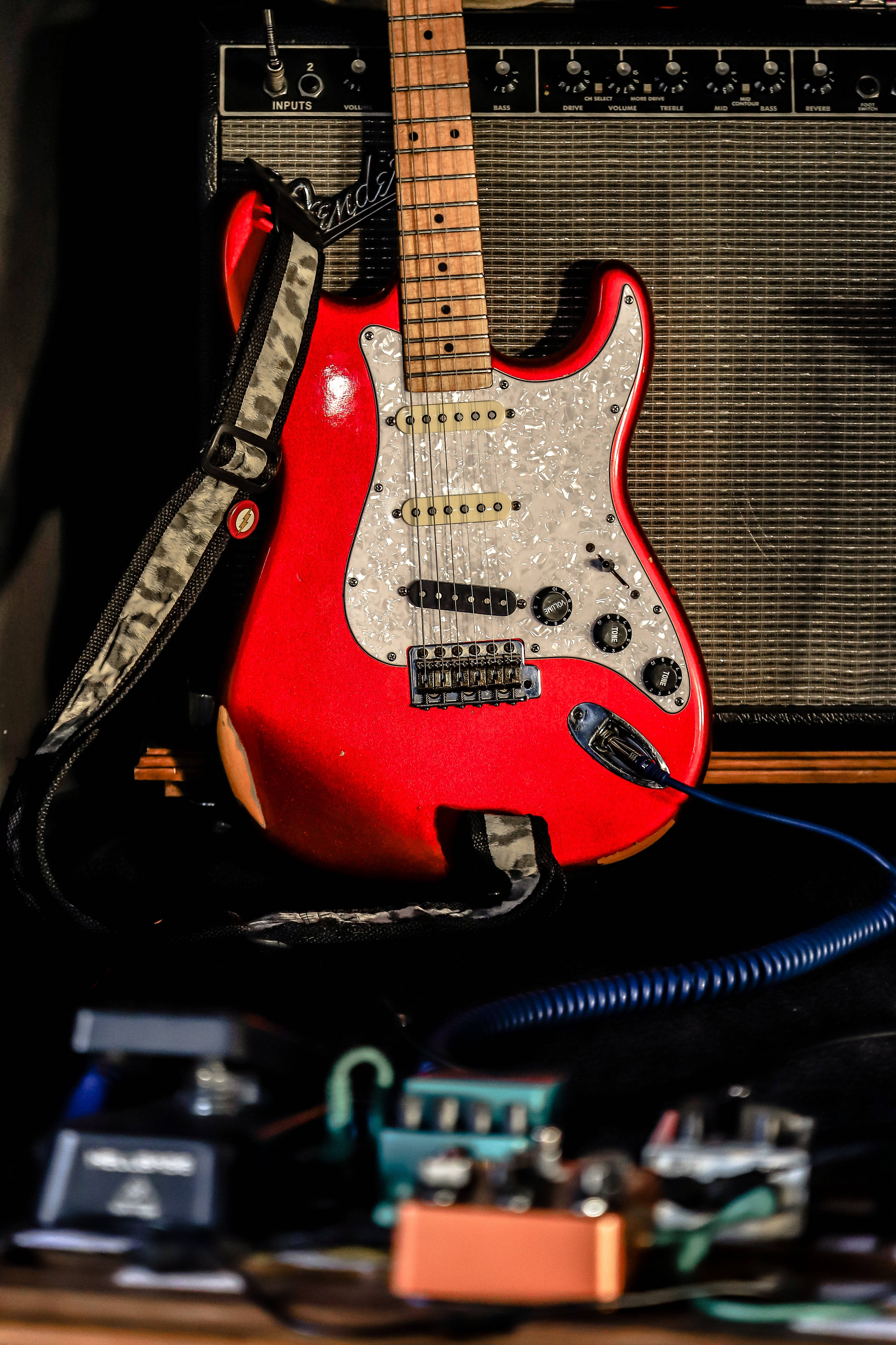 red electric guitar, glittering pickguard, vintage amplifier, 5K Phone Wallpaper