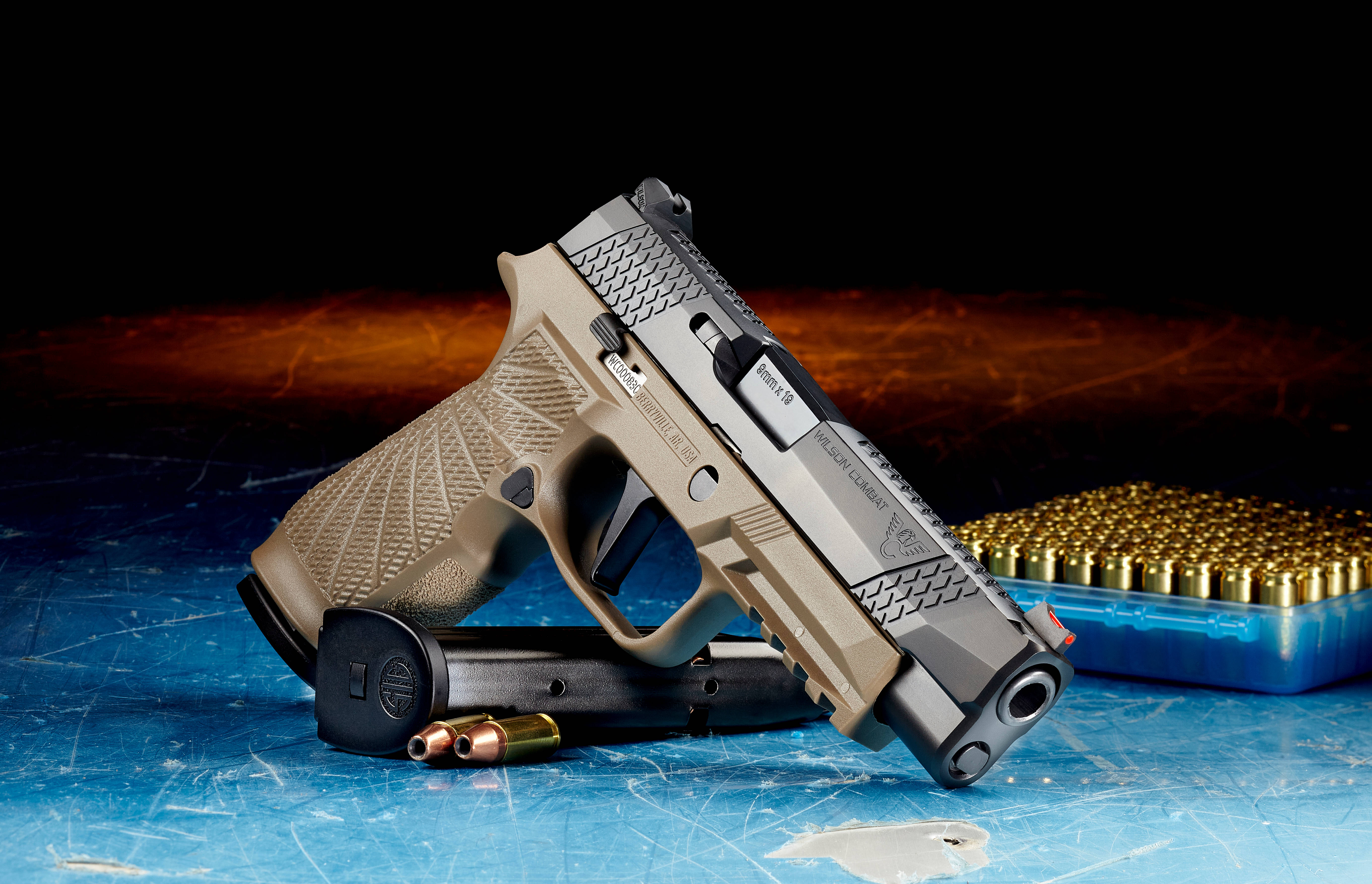 9mm pistol, tan and silver, scratched blue surface, 5K Desktop Wallpaper