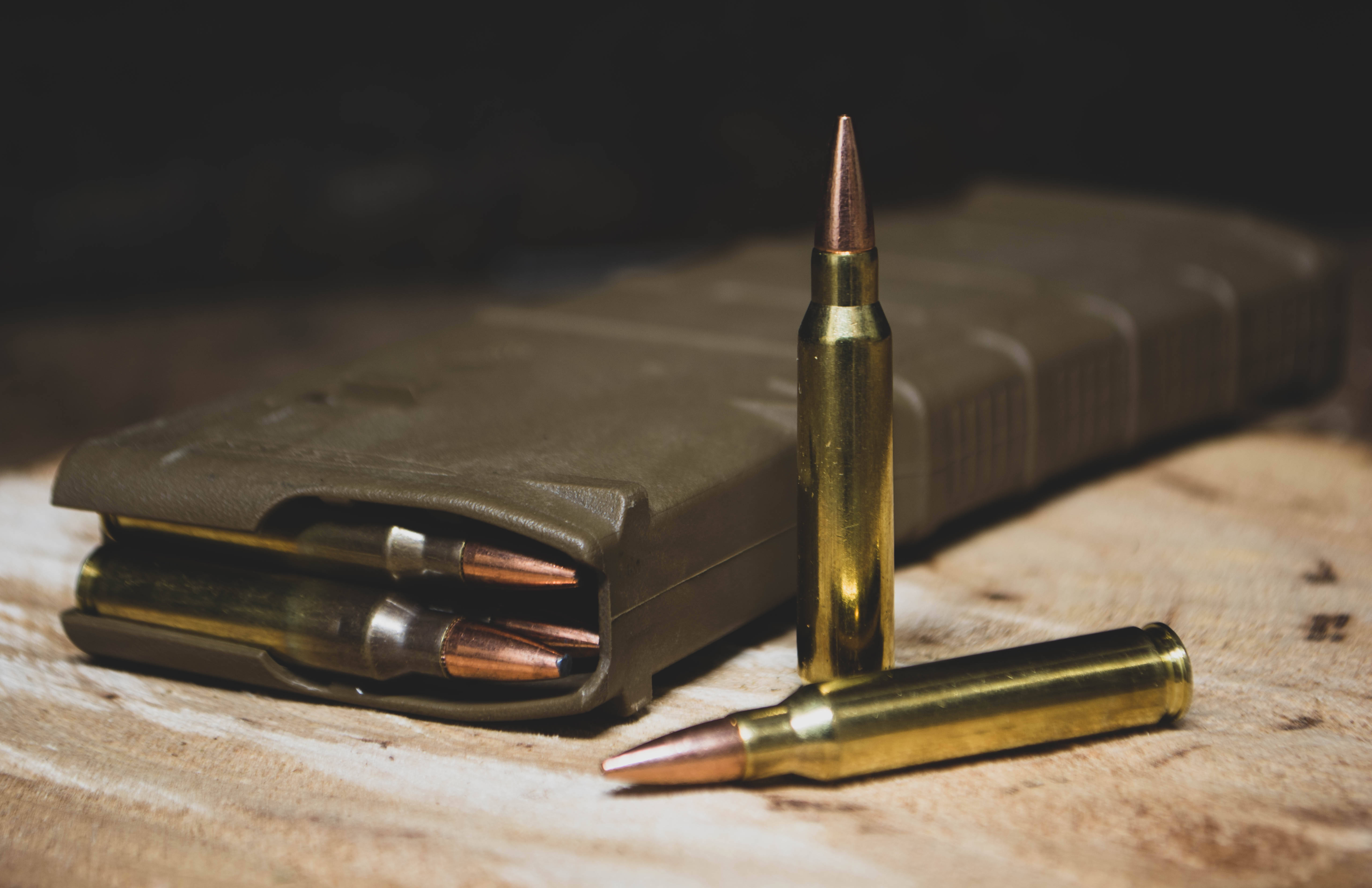 brass rifle bullets, green magazine, weathered wooden surface, 5K Desktop Wallpaper