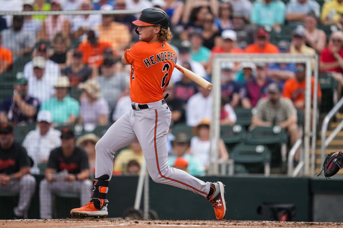 Gunnar Henderson, orange and gray uniform, sunlit field, SD Desktop Wallpaper