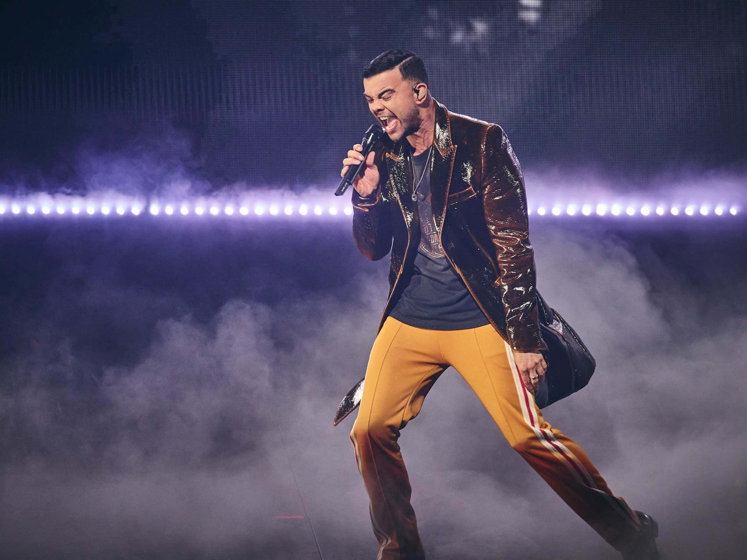 Guy Sebastian, shiny jacket, orange pants, 2K Desktop Wallpaper