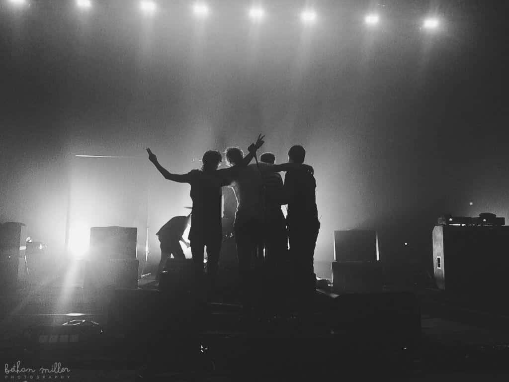Guys, silhouetted band members, stage, SD Desktop Wallpaper
