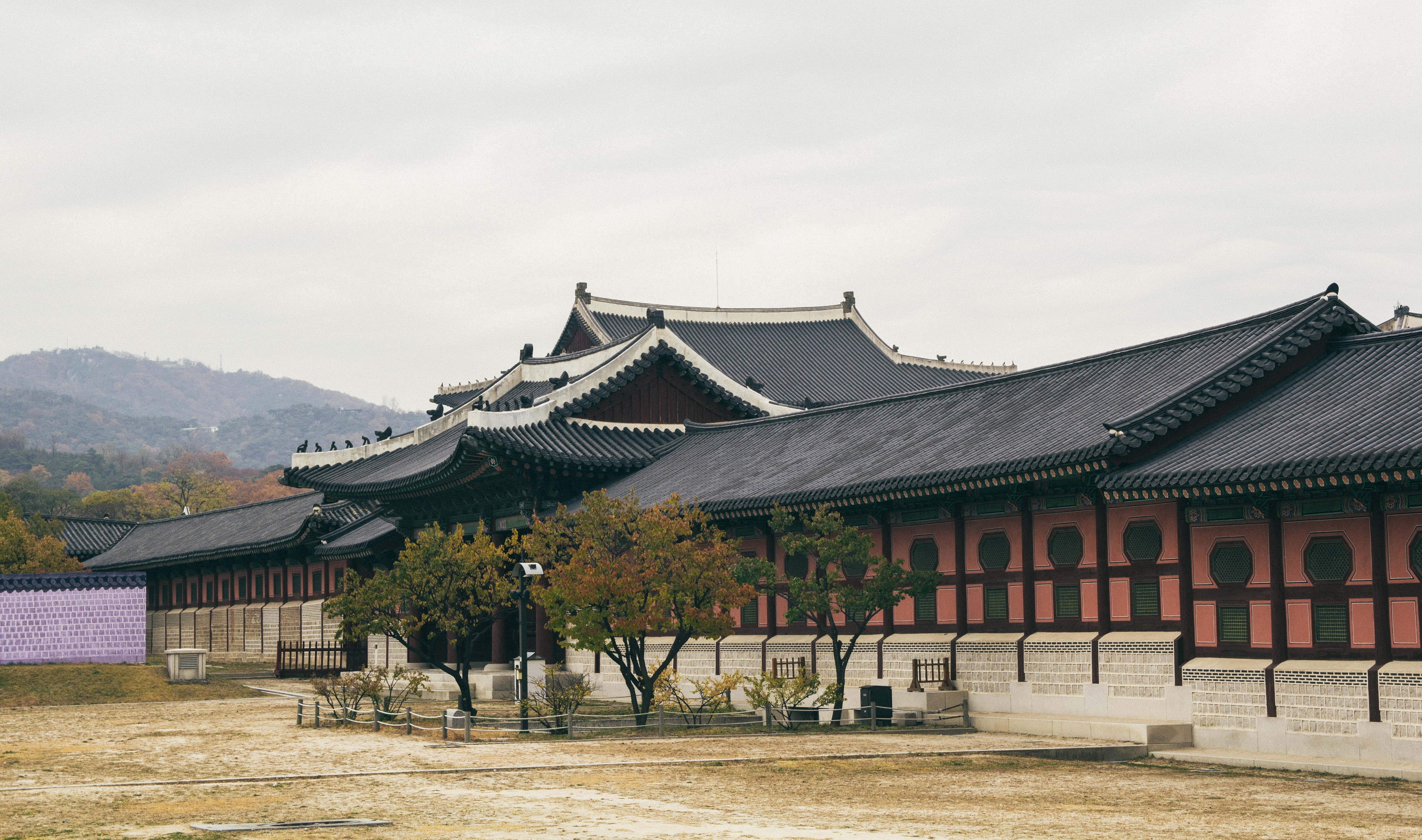 Gyeongbokgung Palace, curved black roofs, red walls, 4K Desktop Wallpaper