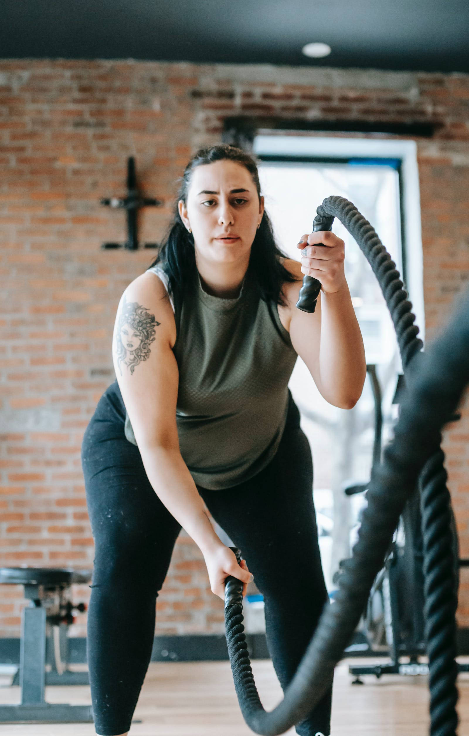 tattooed arm, rustic brick-walled gym, battles ropes, Full HD Phone Wallpaper