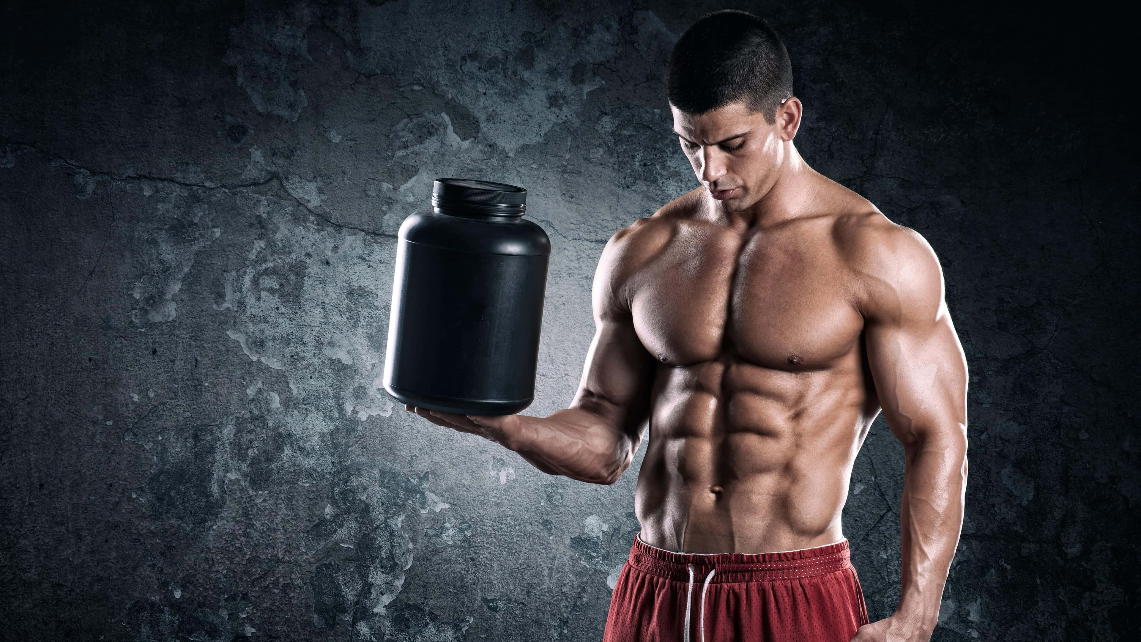 black protein shaker, textured gray concrete wall, shirtless muscular man, 4K Desktop Wallpaper