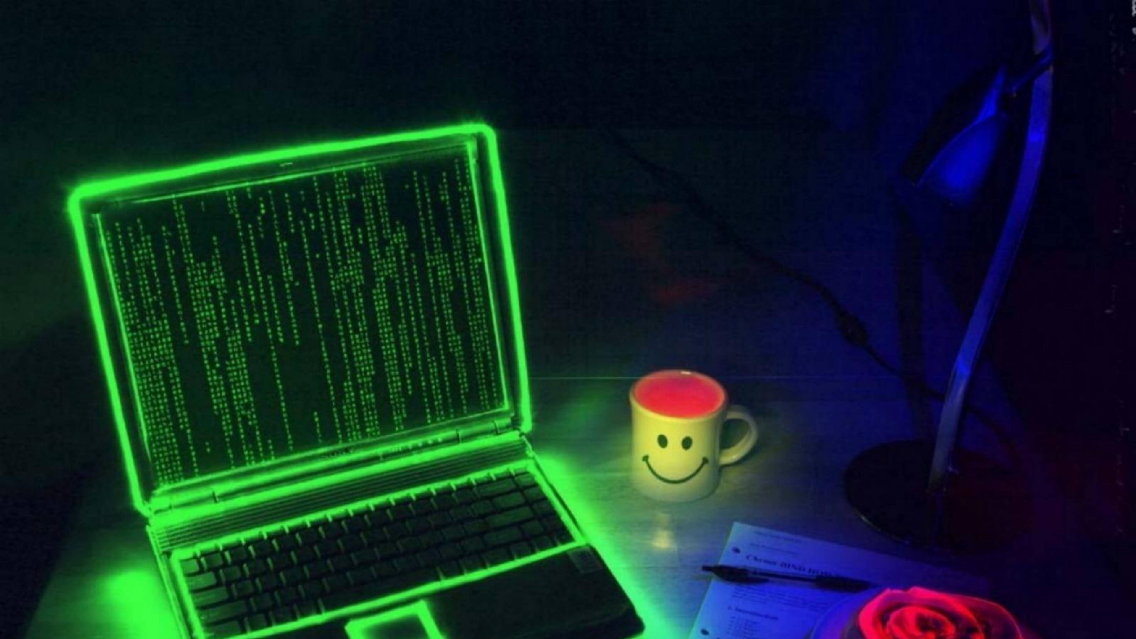 glowing green laptop, falling code, dark desk, 4K Desktop Wallpaper
