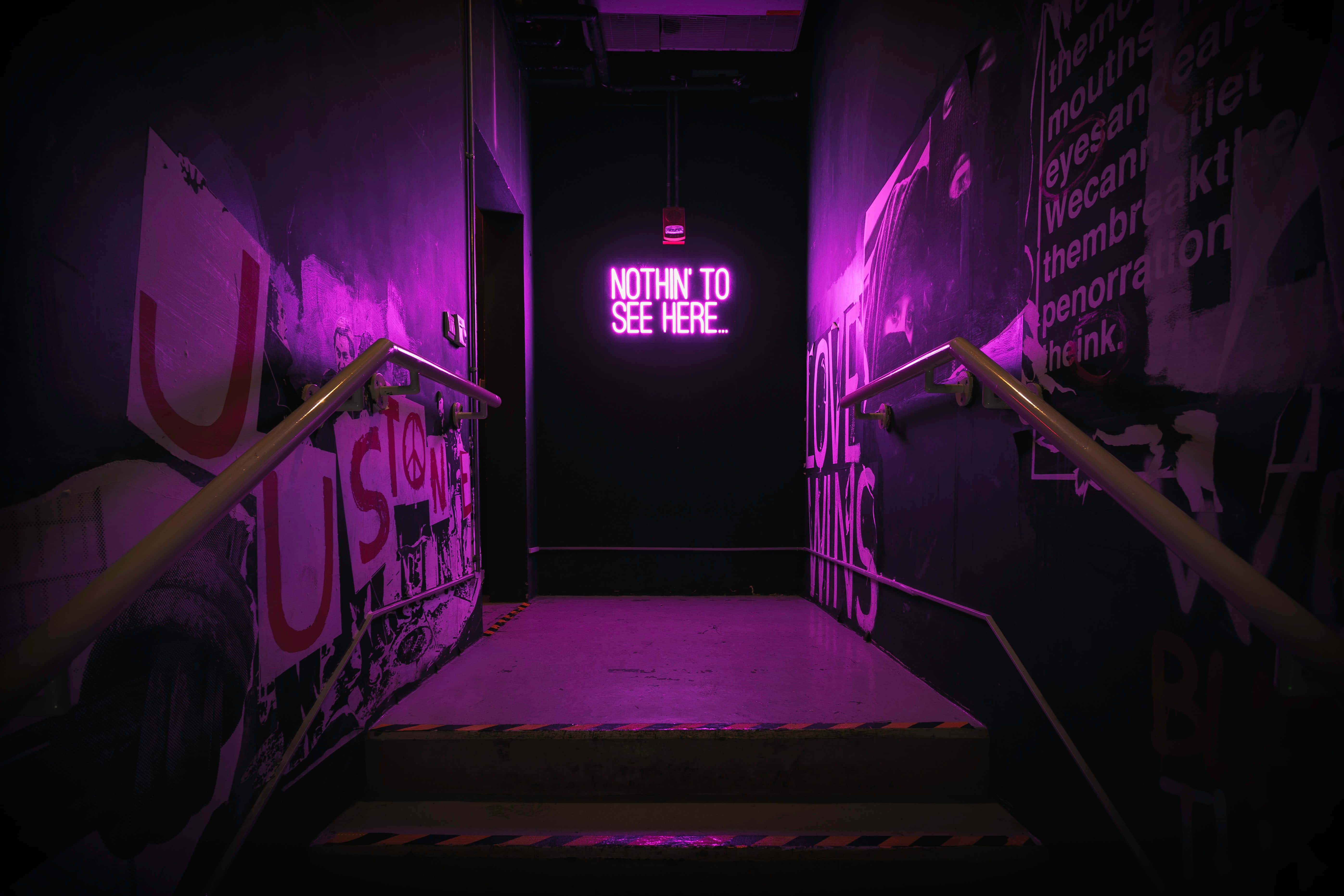 purple neon light, graffiti-covered walls, glowing sign, 5K Desktop Wallpaper