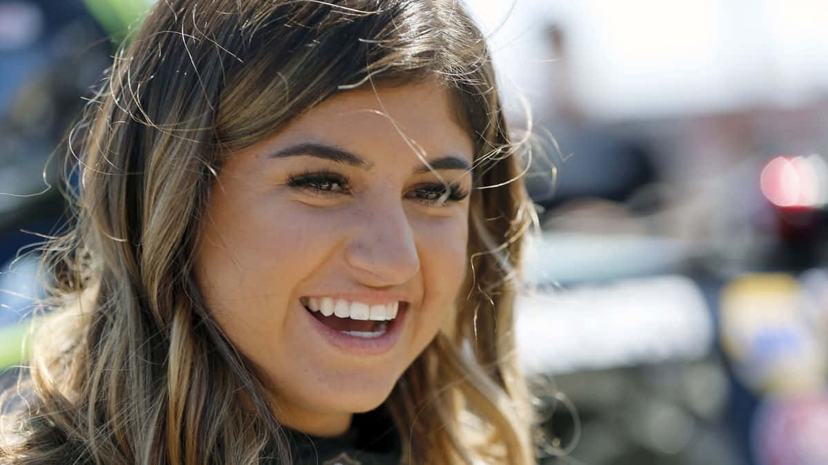 Hailie Deegan, smiling portrait, wavy brown hair, SD Desktop Wallpaper